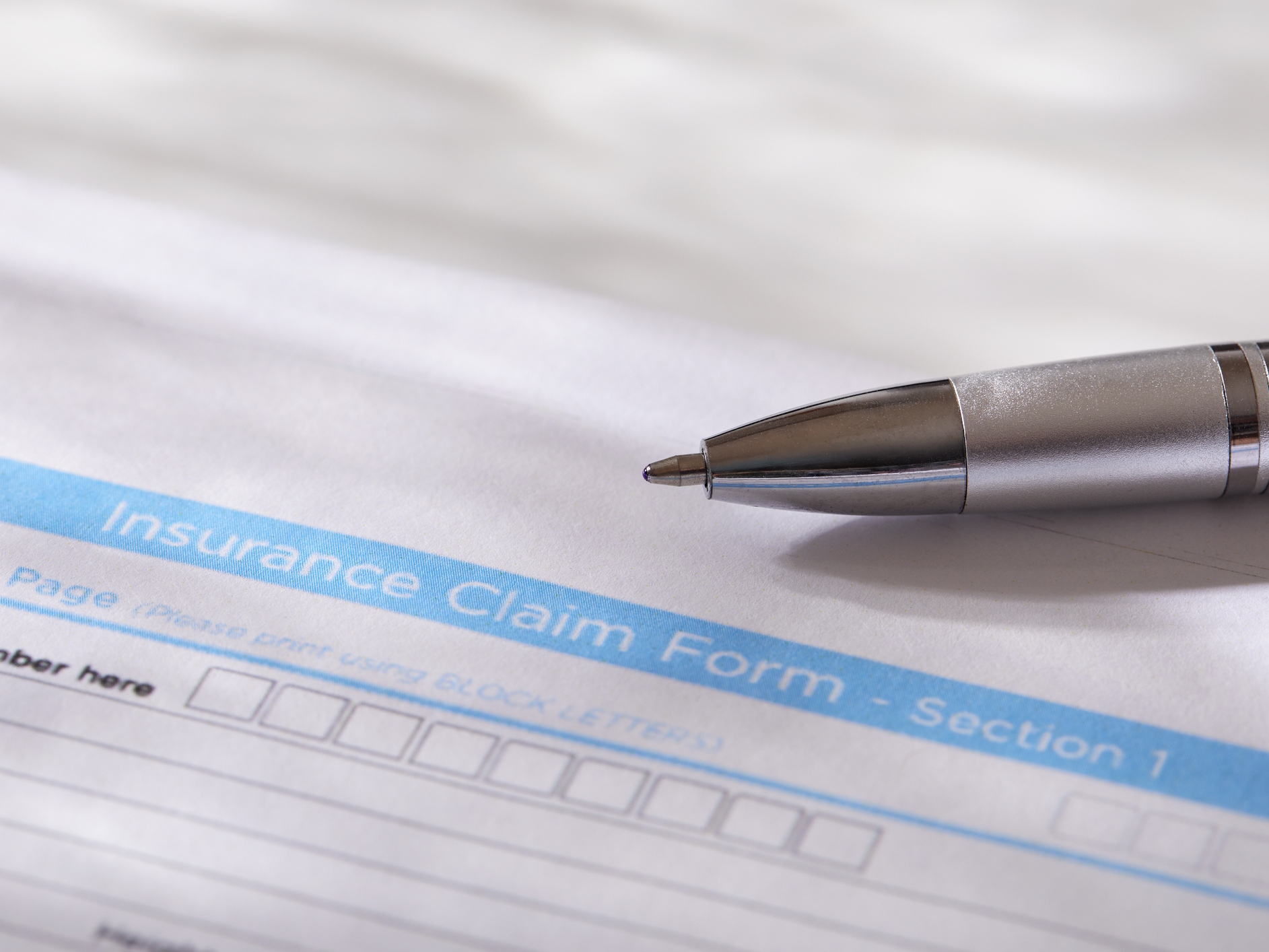 Close-up of insurance form with pen