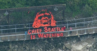 caption: Activist group Backbone Campaign hung this banner in September 2015. Chief Seattle is often quoted by environmental groups.