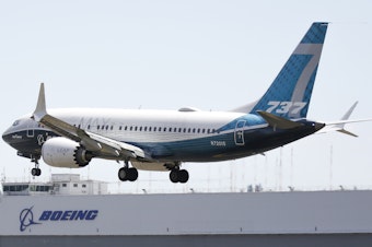 caption: A Boeing 737 MAX jet lands following a Federal Aviation Administration test flight at Boeing Field in Seattle, Wash., in June 2020.