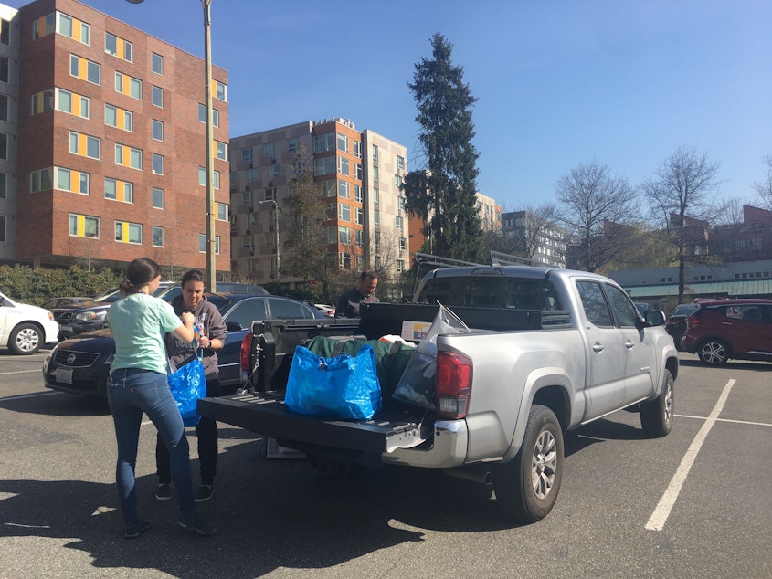 caption: A UW Seattle student and her family pack up her belongings on March 19, 2020. 