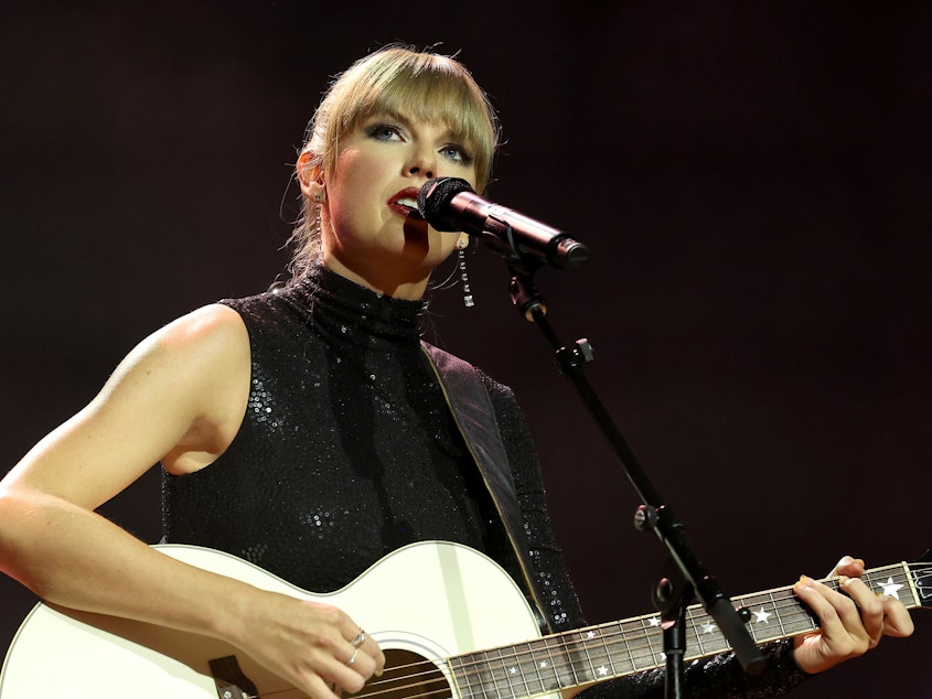 caption: Taylor Swift performs onstage at Ryman Auditorium in Nashville on Sept. 20, 2022.