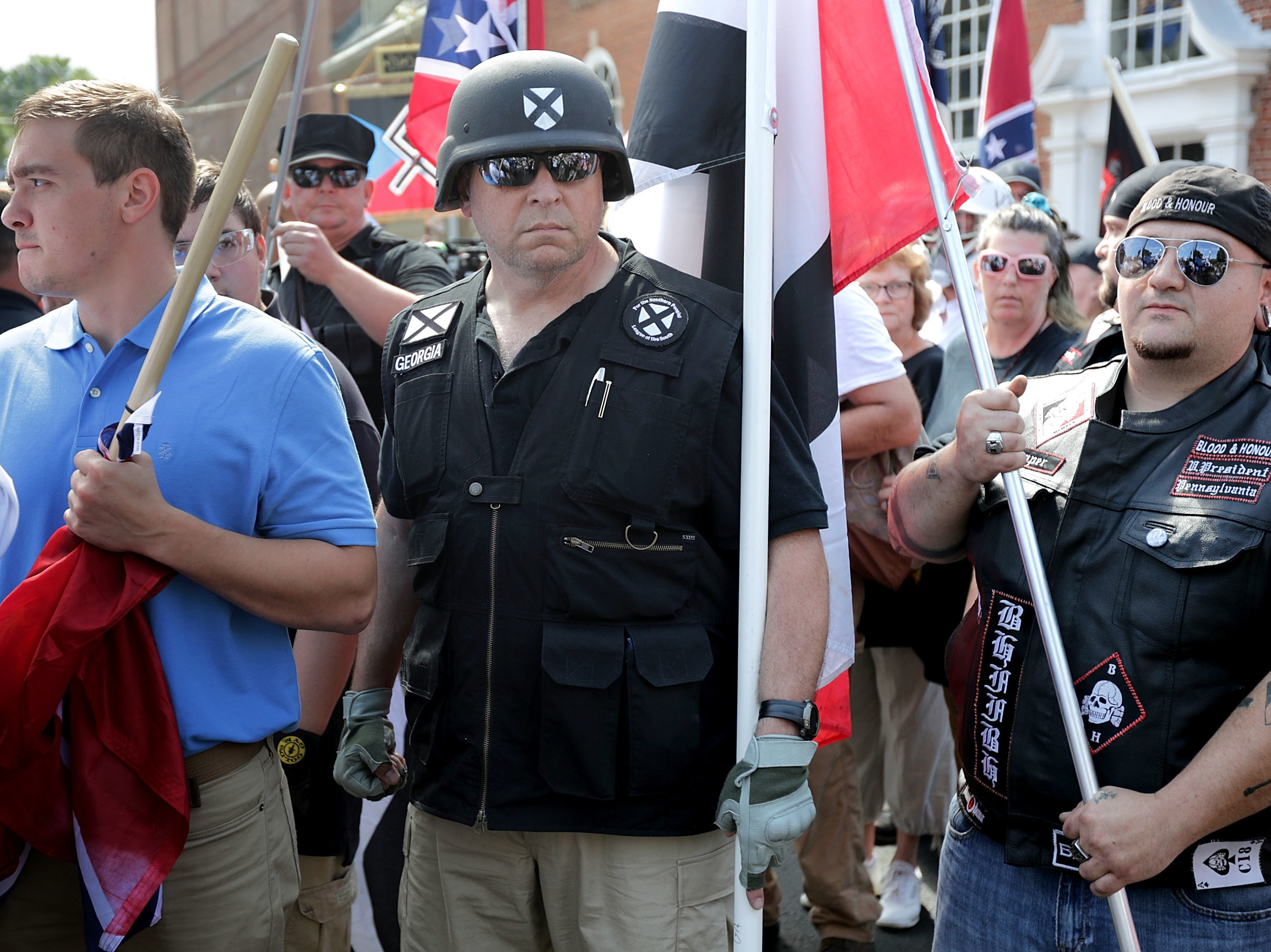 caption: Hundreds of white nationalists, neo-Nazis and members of the "alt-right" march down East Market Street toward Emancipation Park during the "Unite the Right" rally August 12, 2017 in Charlottesville, Virginia.