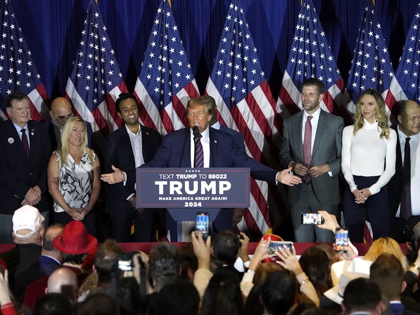 caption: Republican presidential hopeful and former U.S. President Donald Trump gestures as he speaks during an Election Night party in Nashua, N.H., on Jan. 23.