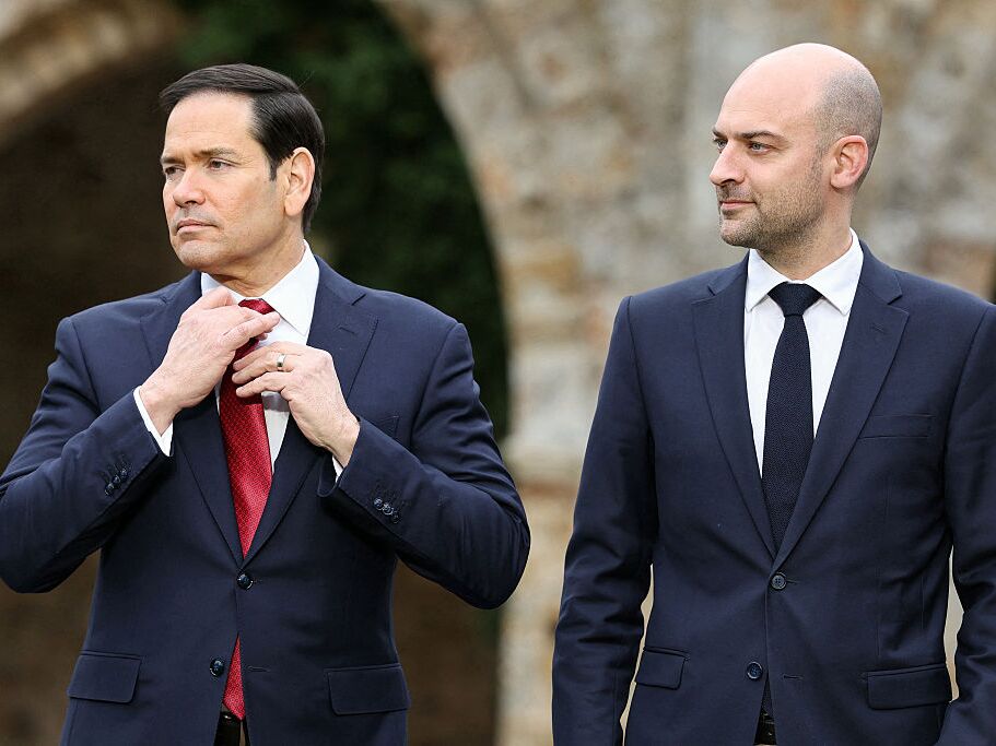 caption: Secretary of State Marco Rubio (left) and French Foreign Minister Jean-Noël Barrot pose for a group photo during a G7 Foreign Ministers' meeting at the Vaux-de-Cernay Abbey in Cernay-la-Ville, outside Paris, on Friday.