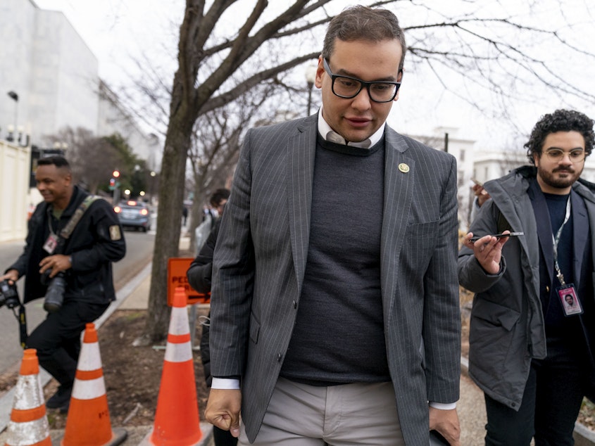 caption: Rep. George Santos, R-N.Y., leaves a House GOP conference meeting in Washington, D.C., on Jan. 25, 2023.
