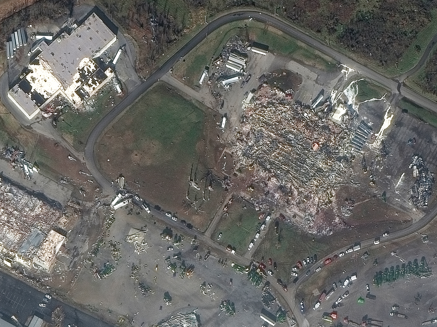 caption: <strong>BEFORE</strong> (left): Overview of Mayfield Consumer Products Candle Factory and nearby buildings before the tornado on Jan. 28, 2017. <strong>AFTER</strong> (right) Overview of the damage to the Mayfield Consumer Products Candle Factory and nearby buildings after the tornado on Dec. 11, 2021.