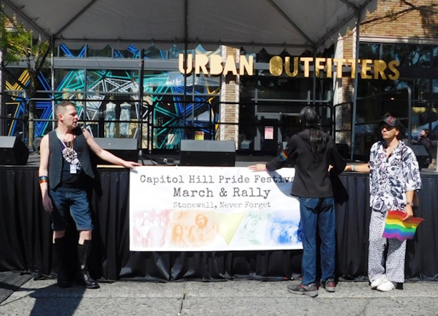 caption: Capitol Hill Pride Festival participants are demonstrating in two marches. One of them is described as, "the Pride version of the Women's March."