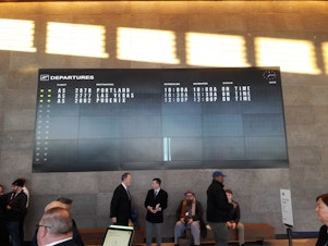 caption: The departure board at Paine Field shows the first flights out on Monday.