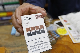 caption: Juul announced that its CEO is stepping down and the company will stop advertising its popular vaping products. The announcements come as regulators work on new rules to curb the use of flavored vaping products among young adults.