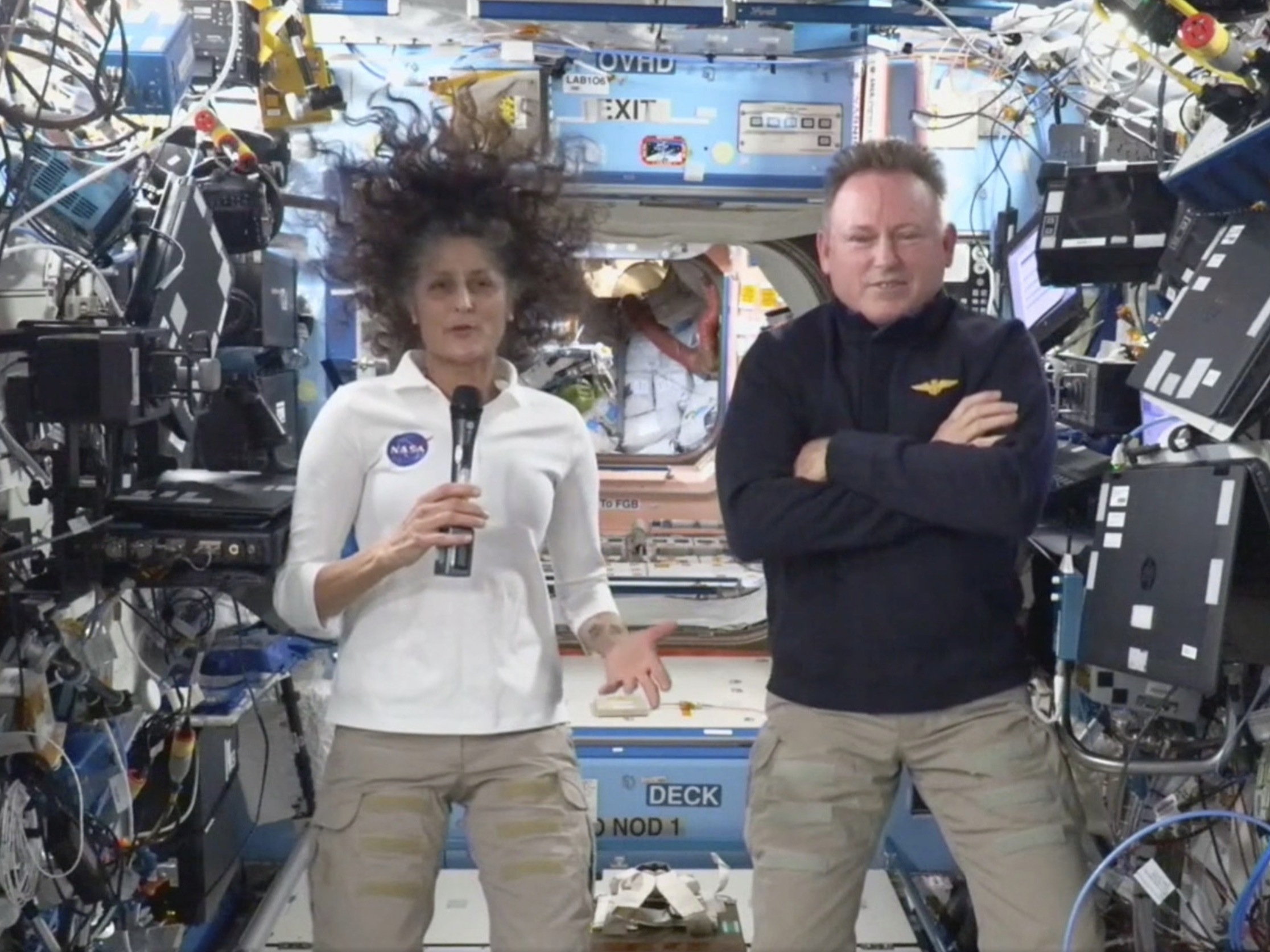 caption: This image made from a NASA live stream shows NASA astronauts Suni Williams and Butch Wilmore during a press conference from the International Space Station on Friday.