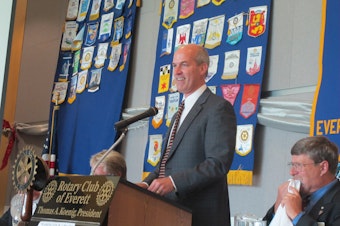 caption: Rep. Rick Larsen speaks to the Everett (Wash.) Rotary in the Grand Vista Ballroom of Naval Station Everett in late August 2011.