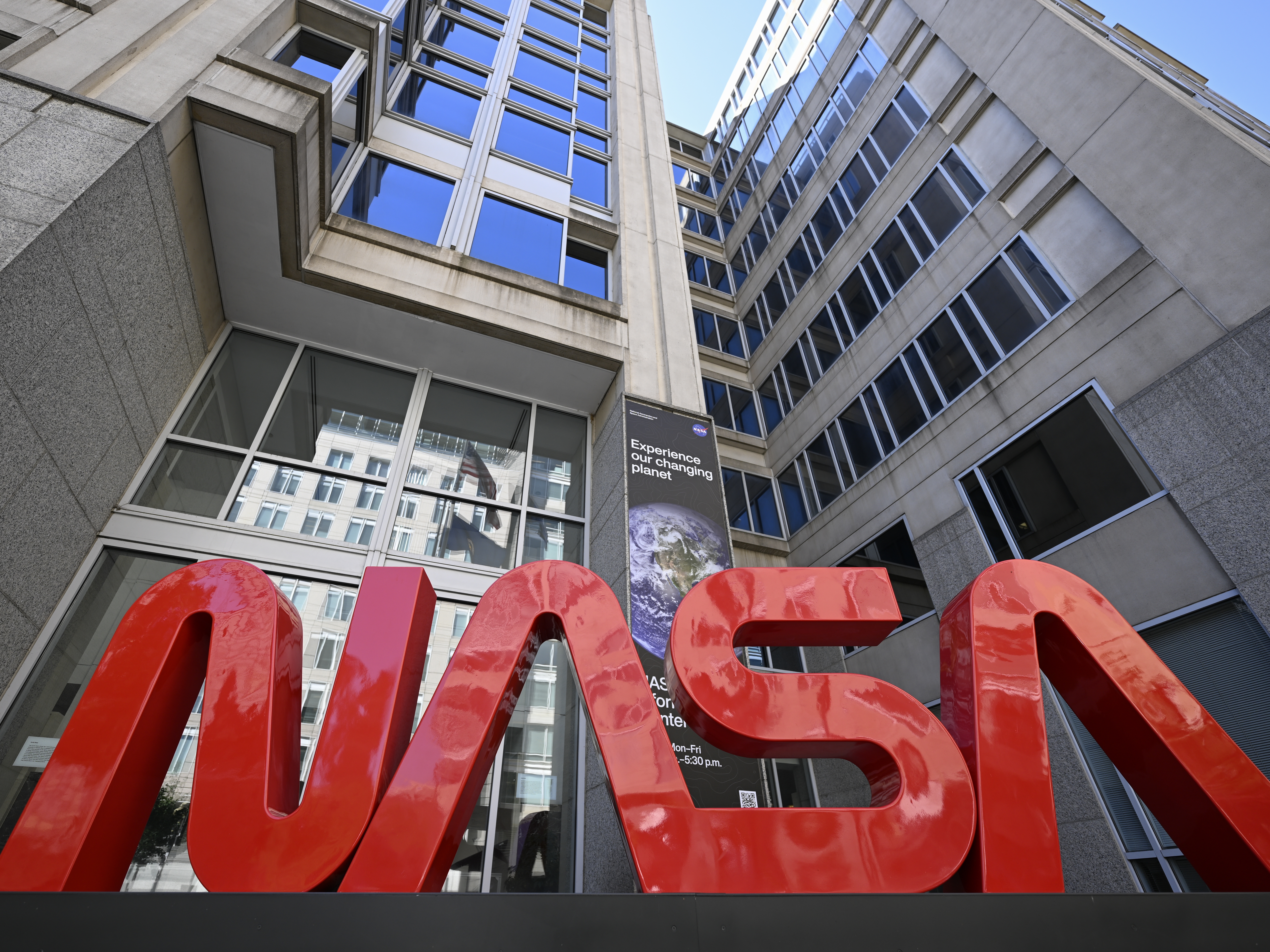 caption: NASA has instructed employees, contractors and grantees to remove all pronouns from their signatures.