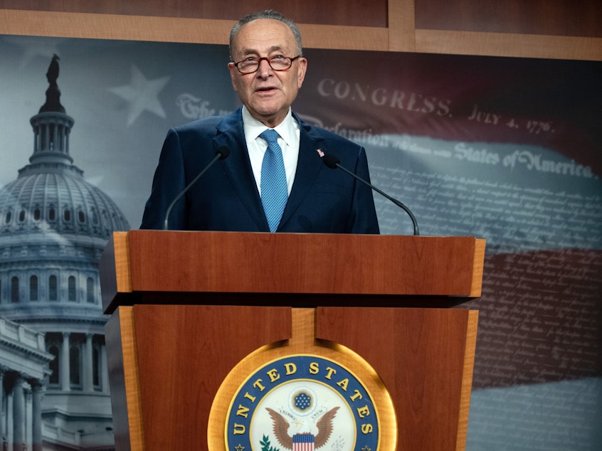 caption: Senate Democratic Leader Chuck Schumer, seen here during a press conference on January 6, 2021, has called for President Trump to be removed from office.