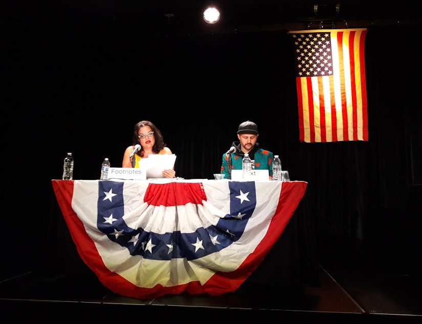 caption: Kathryn Van Meter and Ezra Dickinson reading the Mueller Report around 4 a.m. on Saturday, July 20, 2019.