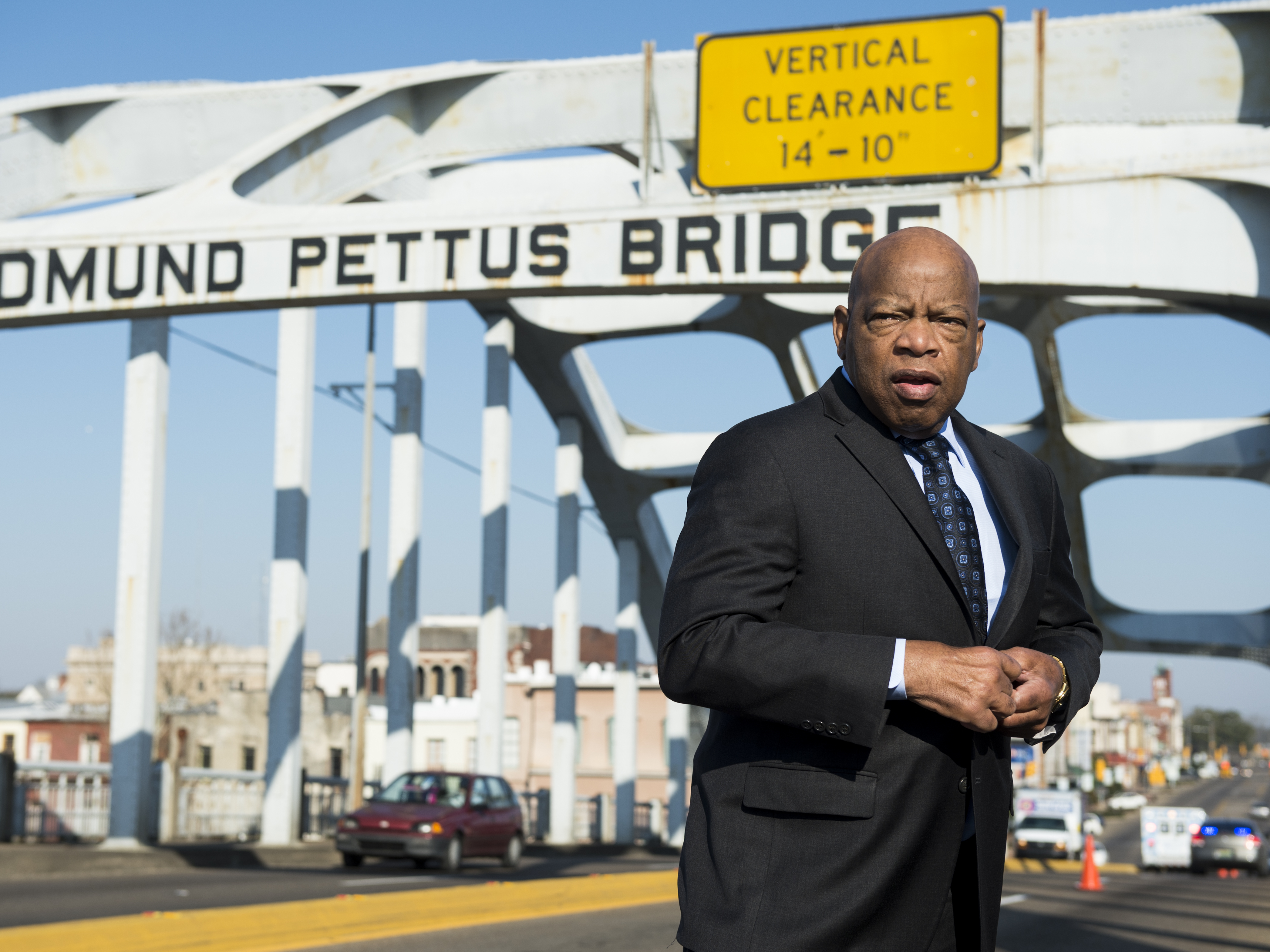 caption: The late Rep. John Lewis stands on the Edmund Pettus Bridge in Selma, Ala., in 2015, where he was beaten by police on "Bloody Sunday."
