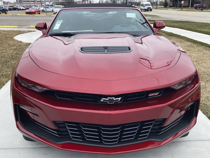 caption: A 2023 Chevy Camaro 2SS Convertible is seen at a dealership in Wheeling, Ill., on  Wednesday. General Motors said it will stop making current generation of the brawny muscle car early next year.
