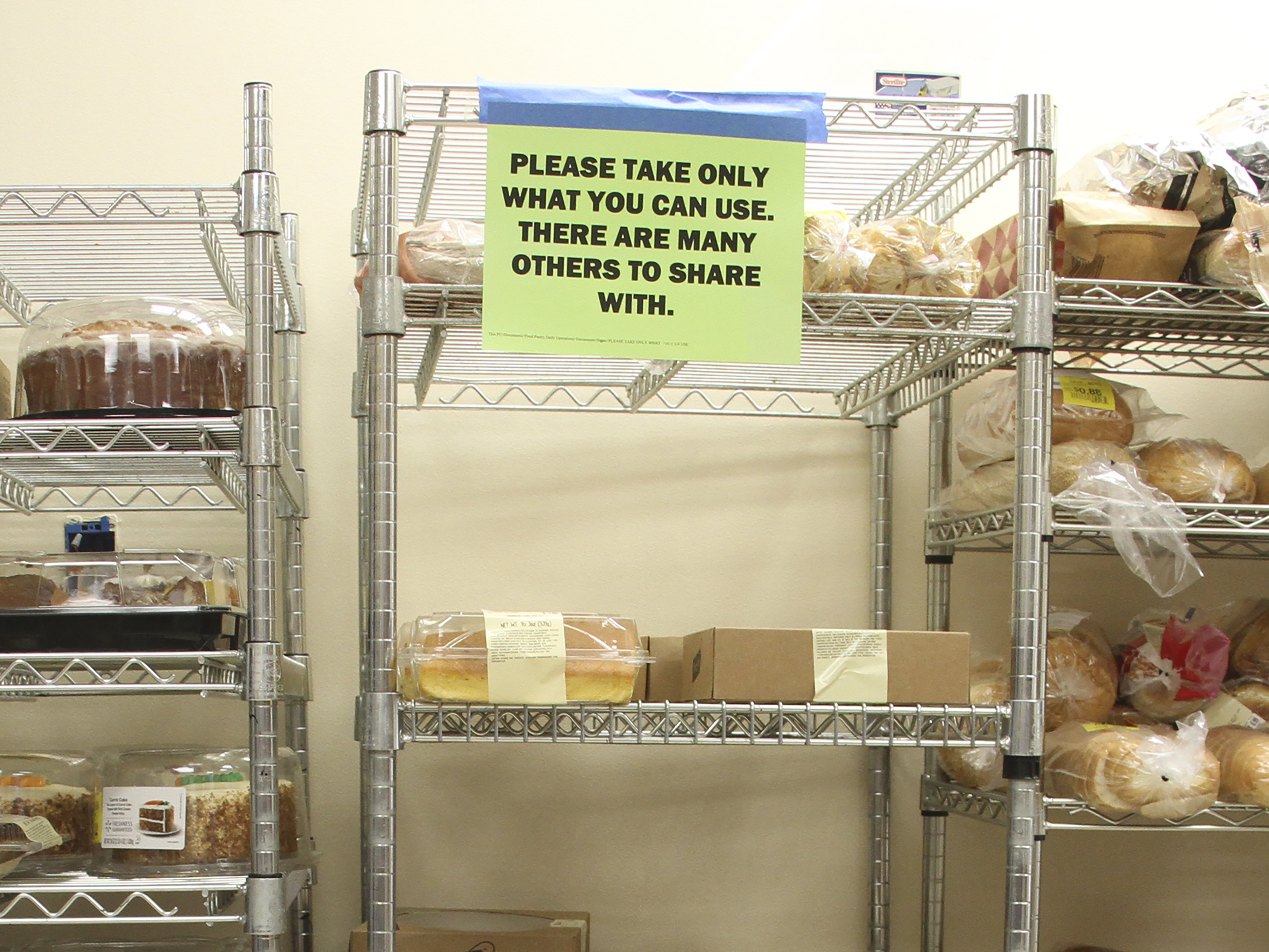 caption: States are preparing for a spike in demand at food banks, like this one inside a church in Eagle River, Alaska, if food aid benefits through the Supplemental Nutrition Assistance Program, or SNAP, are cut off or disrupted because of the federal government shutdown.