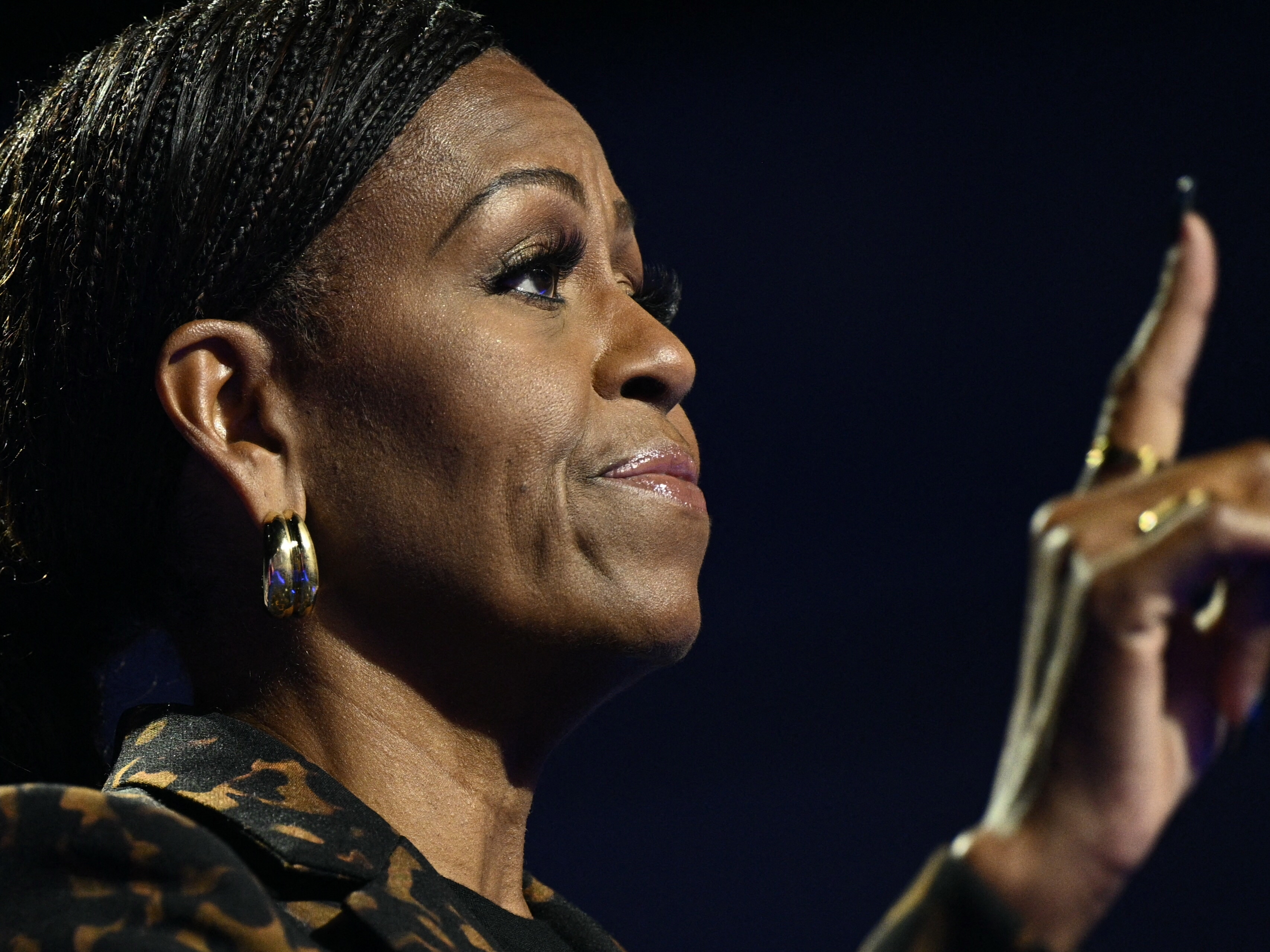 caption: Michelle Obama speaks at a campaign rally in Kalamazoo, Mich., on Oct. 26, 2024.