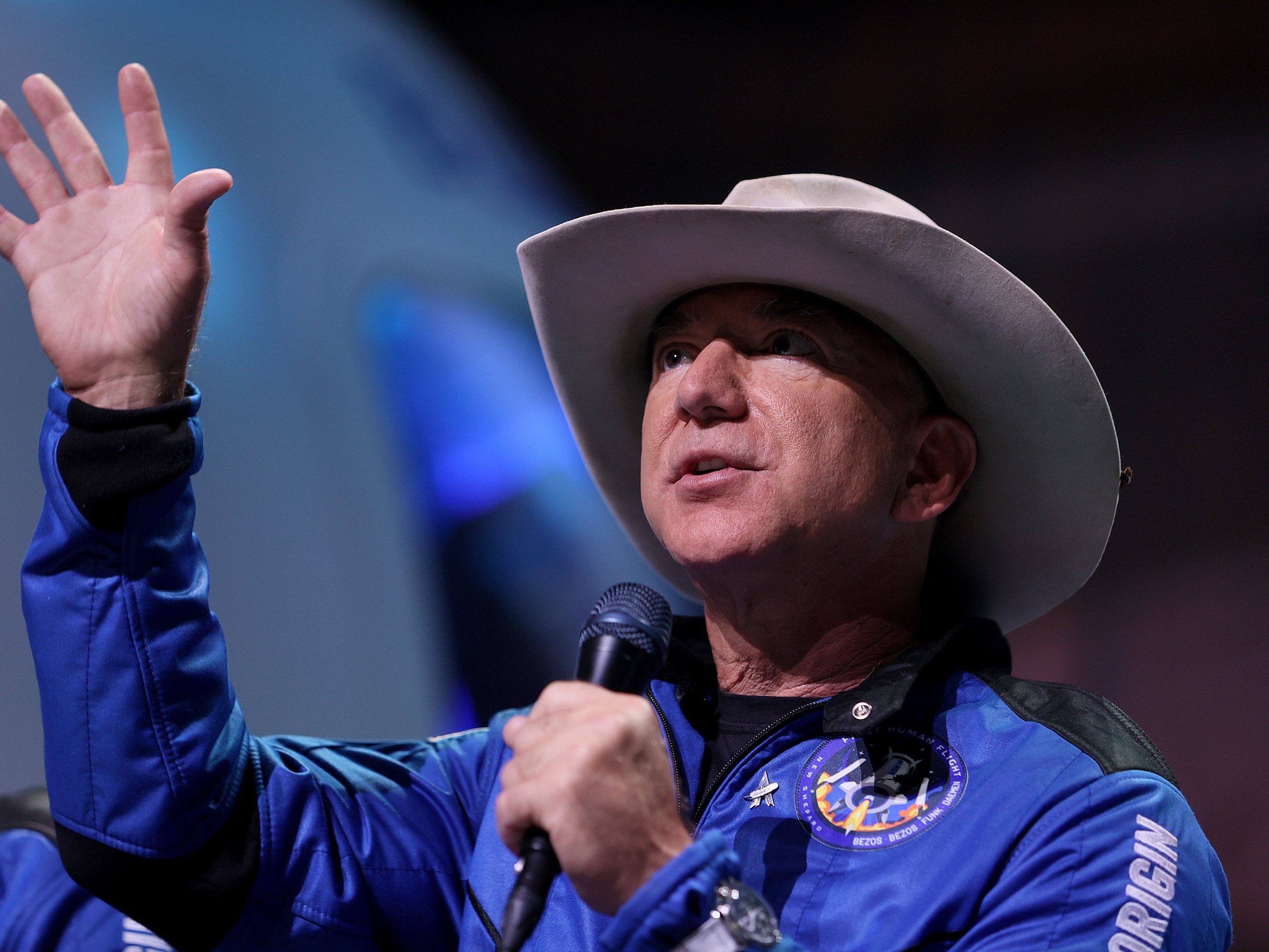 caption: Jeff Bezos discusses his brief space flight on Blue Origin's New Shepard rocket at a July 20 news conference in Van Horn, Texas. Blue Origin is suing NASA over a lunar lander contract awarded to rival SpaceX.