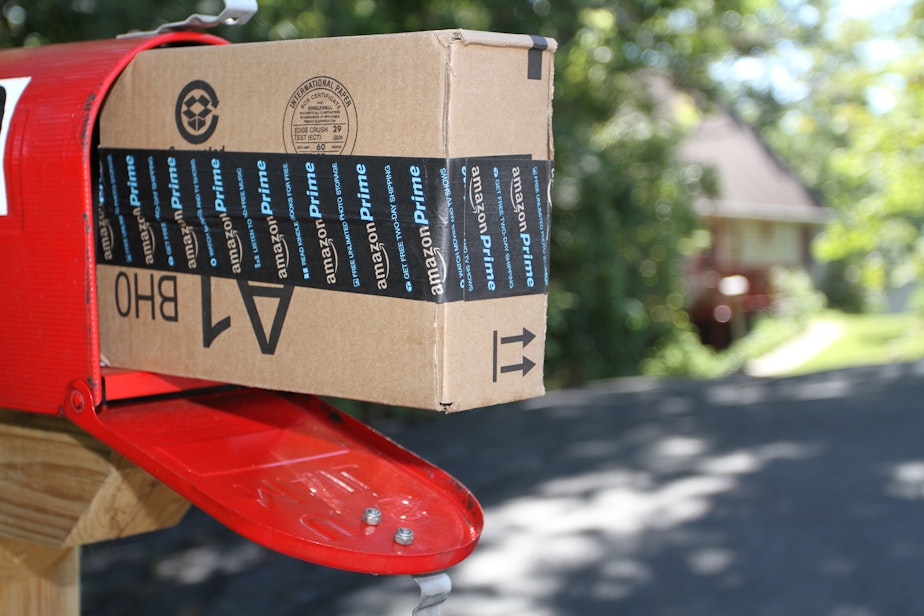 caption: A box containing an order from Amazon.com is shown after it was delivered to a house in Etters, Pa, Wednesday, Sept 16, 2005.