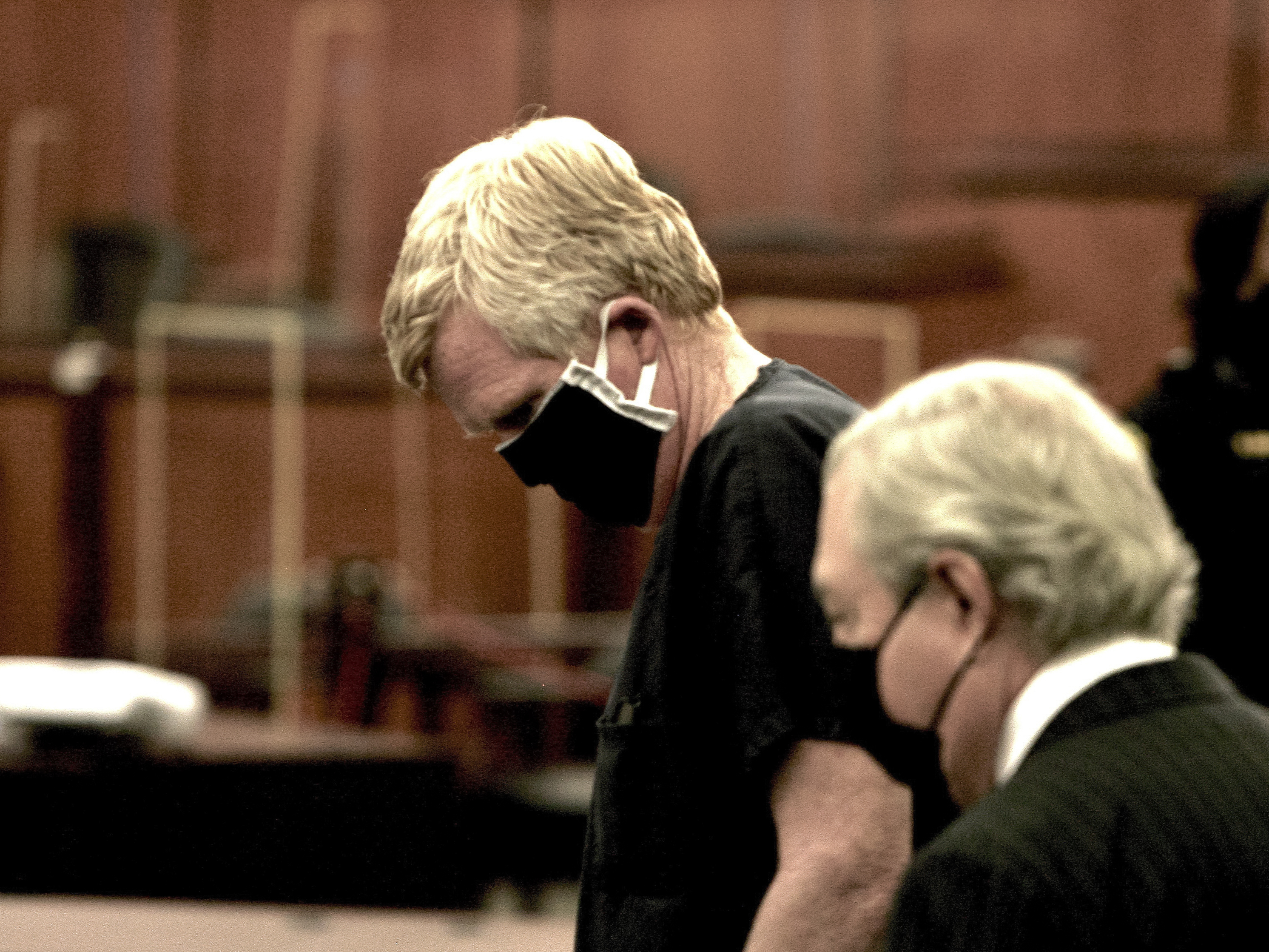 caption: Alex Murdaugh awaits the beginning of his bond hearing in Columbia, S.C., on Oct. 19, 2021. Murdaugh pleaded not guilty on Wednesday to murdering his wife and son.