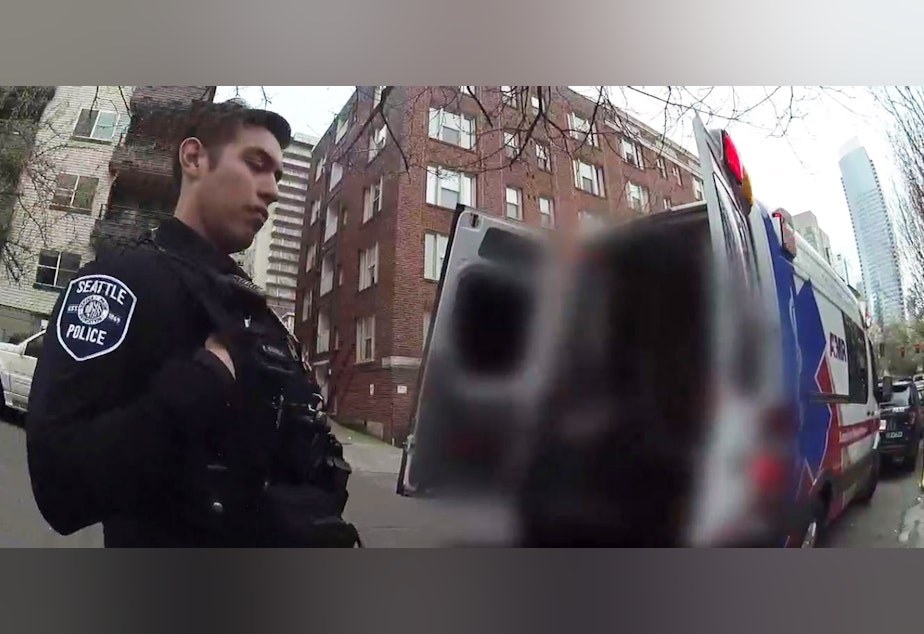 caption: A screenshot of a body camera video during a call to June's apartment. June is a frequent 911 caller in Seattle.