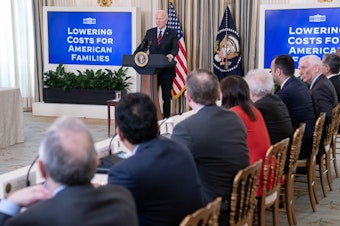 caption: President Biden convened his Competition Council at the White House on March 5 after his administration announced new actions to cap credit card late fees at $8, compared with $32.