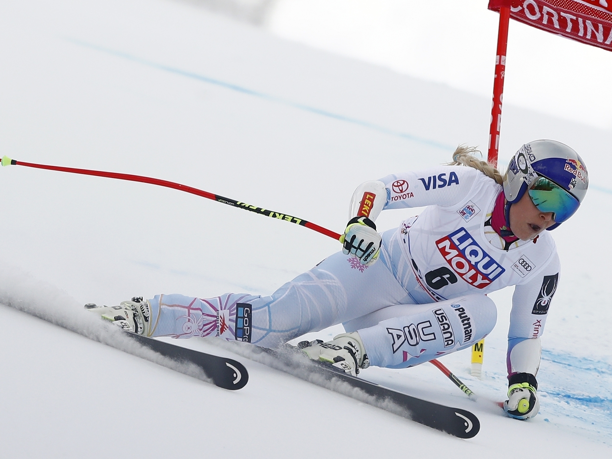 caption: American Lindsey Vonn speeds down the course during the women's World Cup super-G ski race in Cortina D'Ampezzo, Italy, in 2018.
