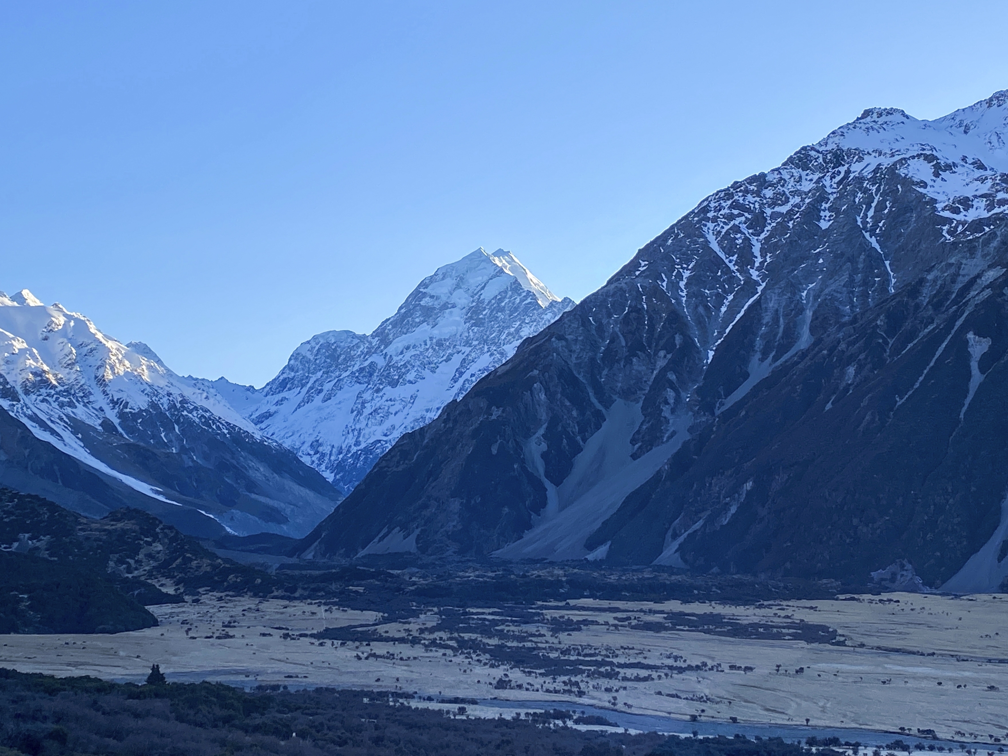 caption: New Zealand's highest peak, Aoraki, centre, is seen in the Aoraki/Mount Cook National Park, on Aug. 17, 2020.