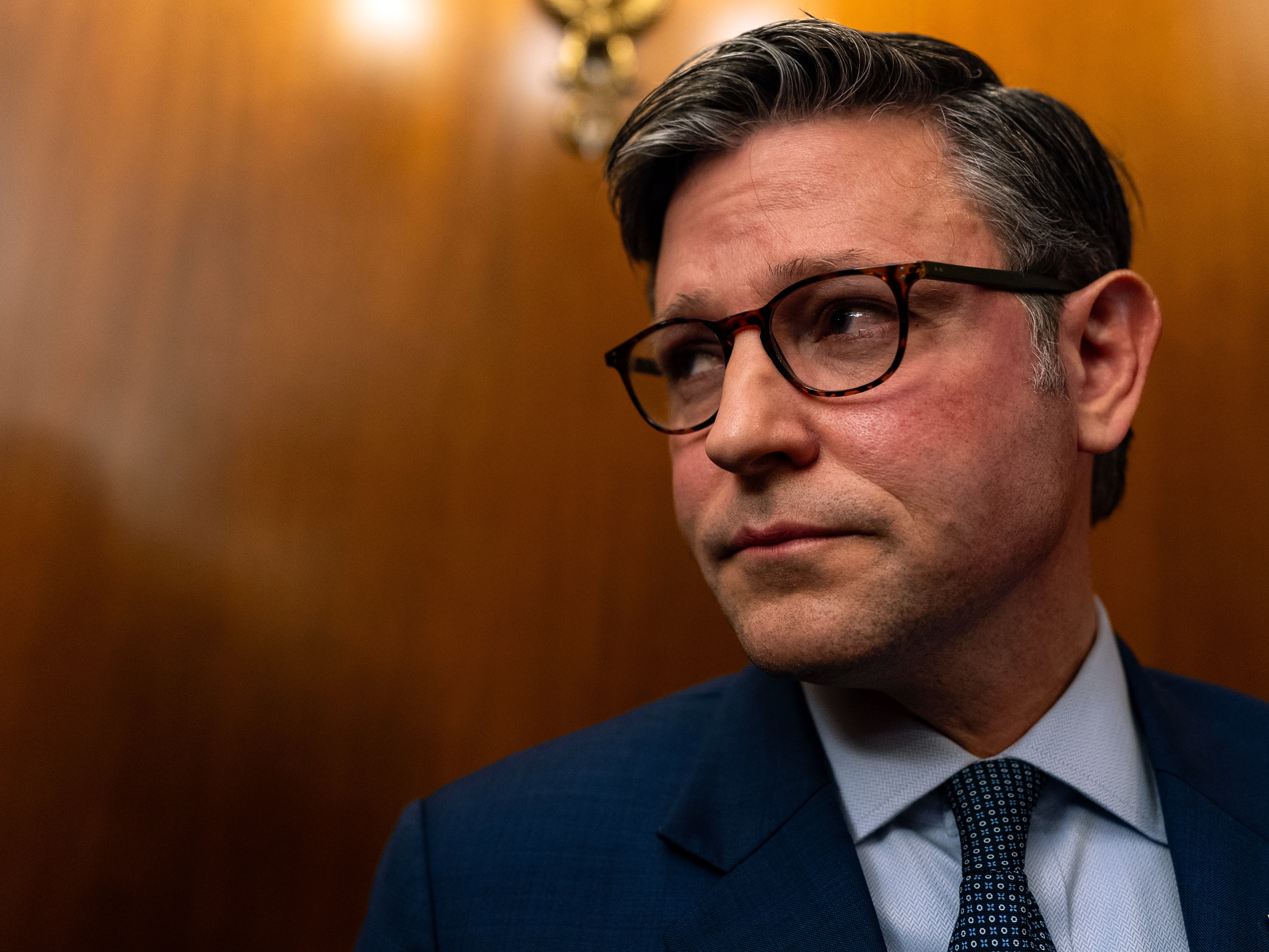 caption: Speaker of the House Mike Johnson, R-La., departs a press conference at the U.S. Capitol on Tuesday. Johnson has been working to rally House Republicans behind a stopgap funding bill to avert a government shutdown, while also navigating growing pressure to boost security for lawmakers in the wake of Charlie Kirk's killing.