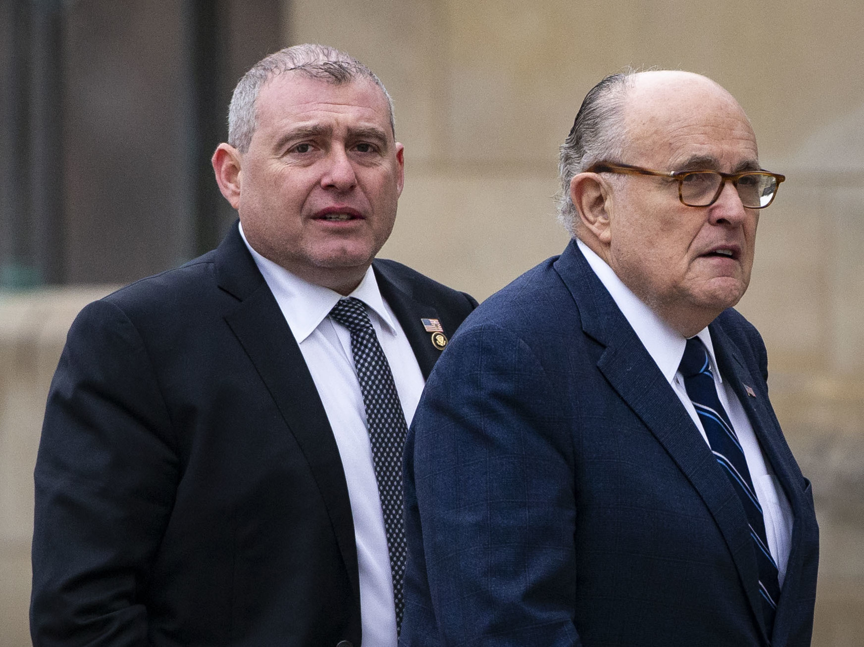 caption: Rudy Giuliani, President Trump's personal lawyer, (right) walks with Lev Parnas in late 2018. Parnas says text messages last year between him and congressional candidate Robert Hyde about surveilling former Ambassador Marie Yovanovitch were taken out of context. But Ukrainian police are investigating the allegations.
