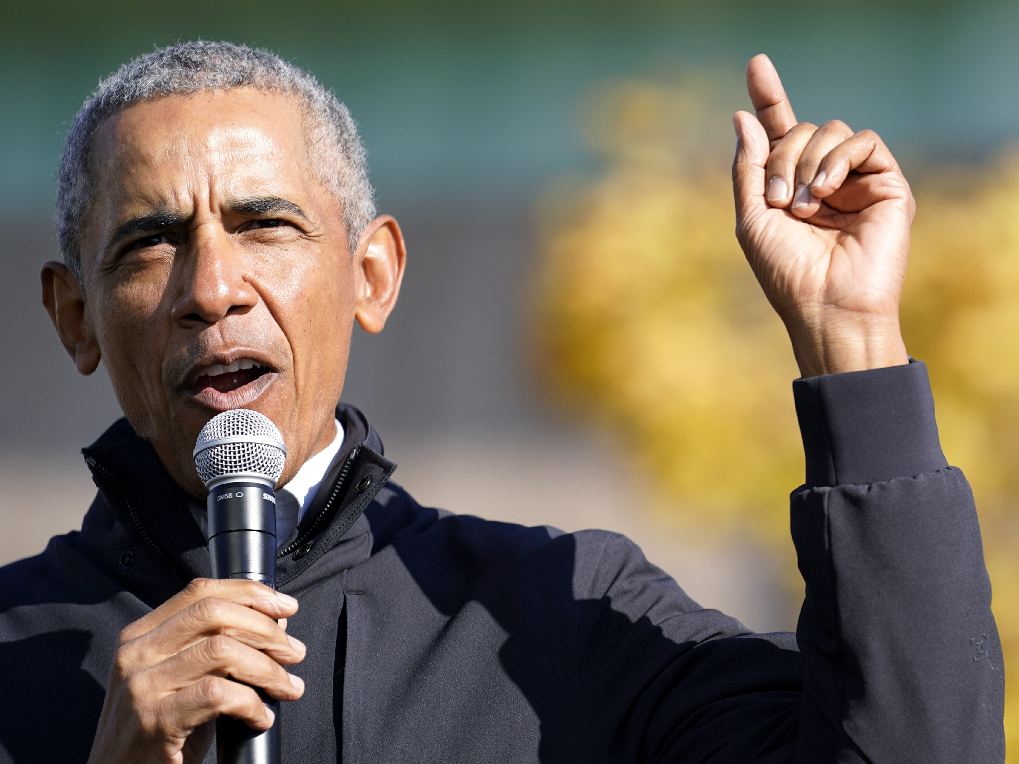 caption: Former President Barack Obama speaks at a rally for Joe Biden in Flint, Mich. on Oct. 31. In an interview with NPR, Obama said Trump was "denying reality" by refusing to concede the election to Biden.