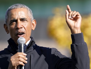 caption: Former President Barack Obama speaks at a rally for Joe Biden in Flint, Mich. on Oct. 31. In an interview with NPR, Obama said Trump was "denying reality" by refusing to concede the election to Biden.