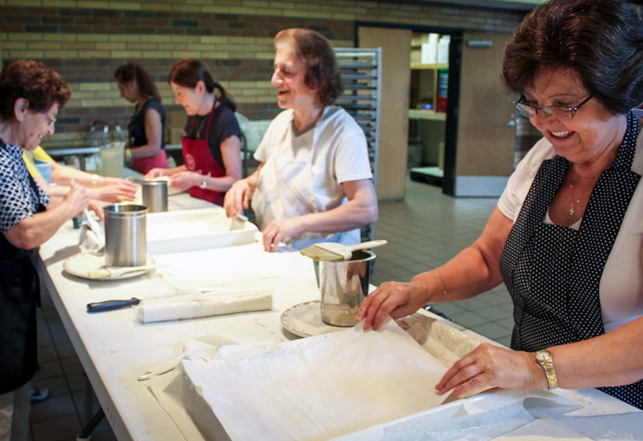 Theo Polizos, right, prepares bougatsa at St. Demetrios Greek Orthodox Church in Seattle.