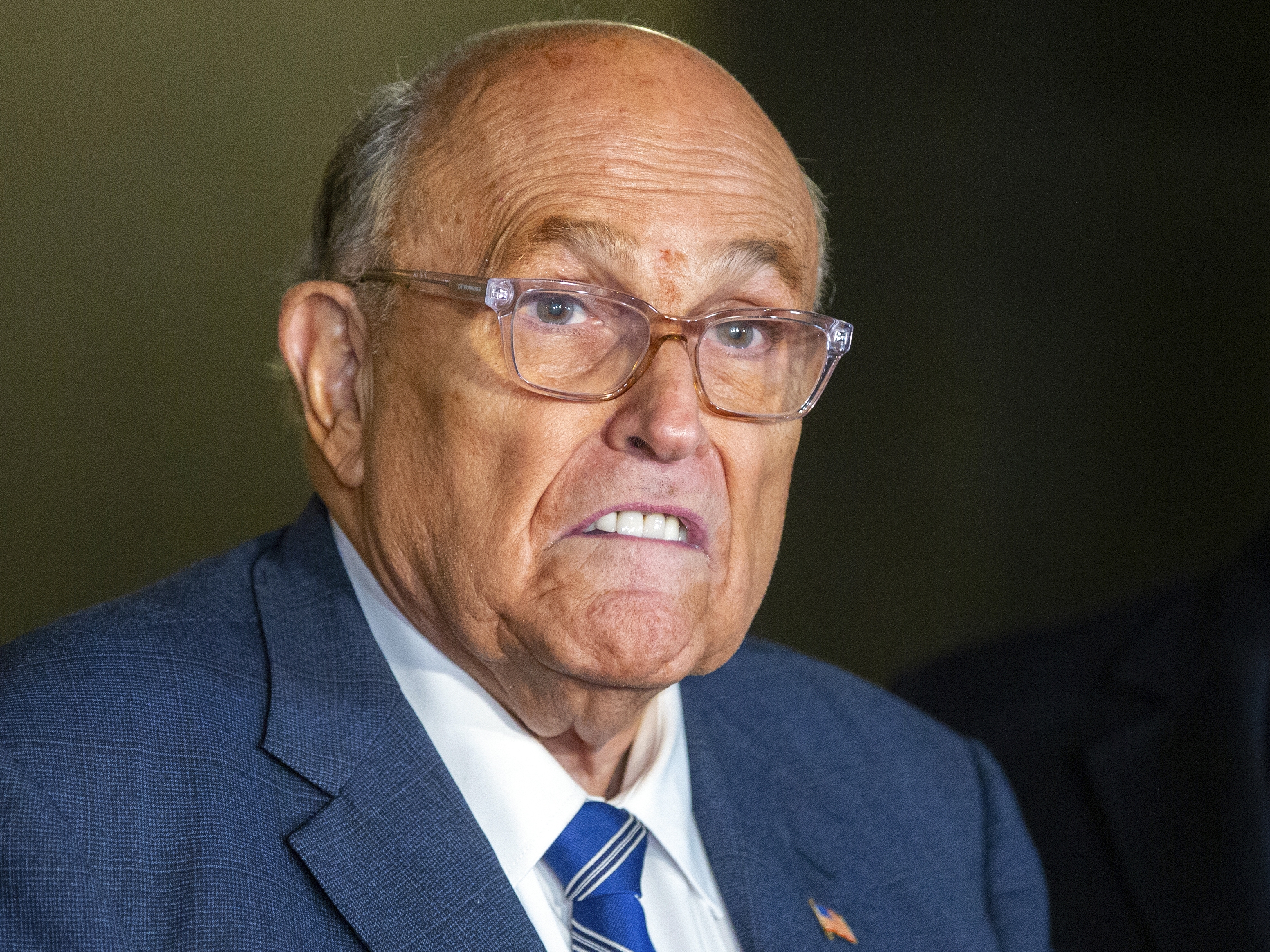 caption: Rudy Giuliani speaks to the media outside Manhattan federal court in New York, Jan. 3, 2025.
