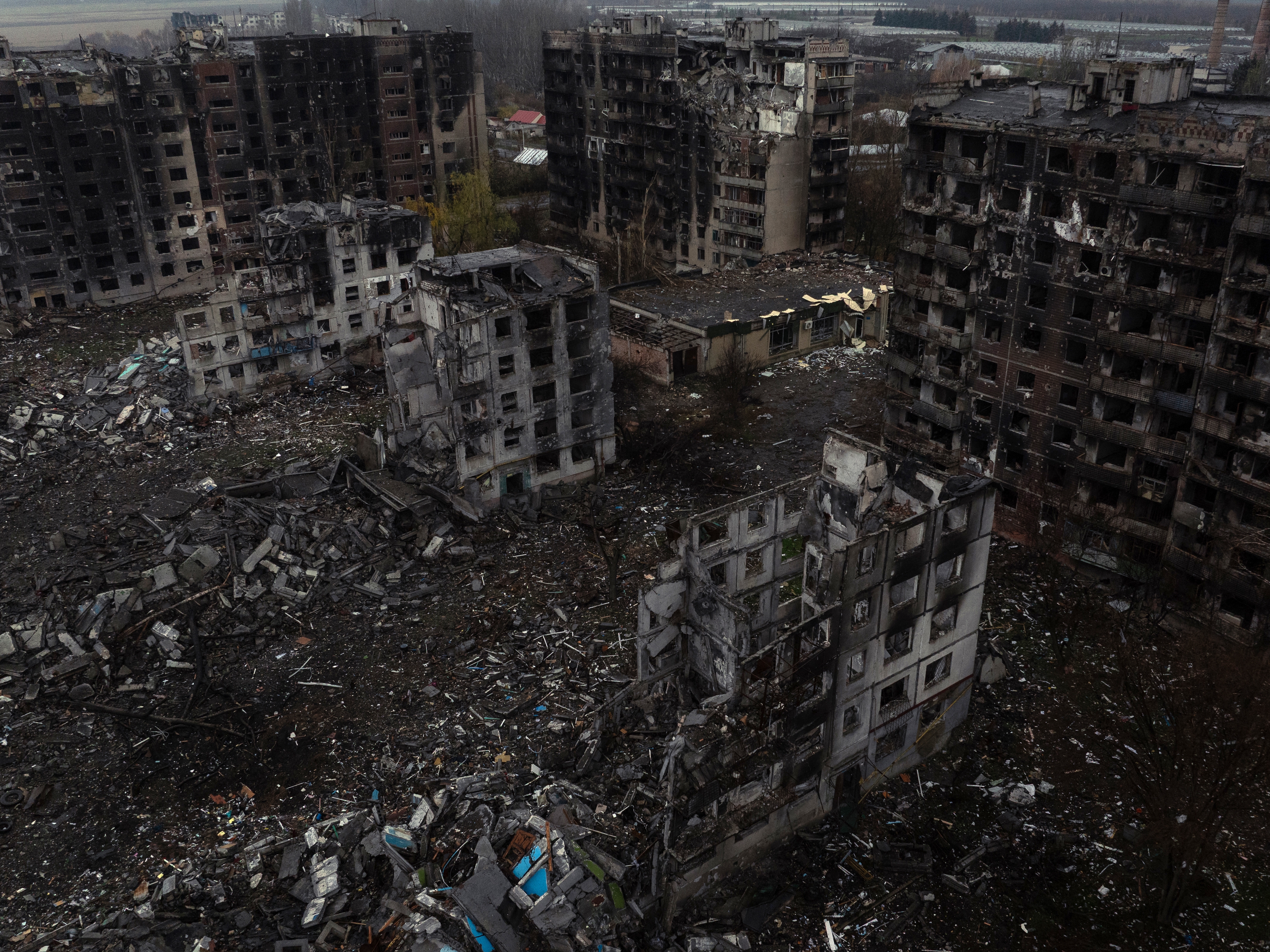 caption: This handout photograph, taken on Nov. 12 by the press service of the 93rd Kholodnyi Yar Separate Mechanized Brigade of the Ukrainian Ground Forces, shows an aerial view of destroyed buildings in the front-line town of Kostyantynivka, Donetsk region, amid the Russian invasion of Ukraine.