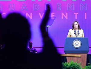 caption: Supporters cheer as Vice President Harris addresses the 20th Quadrennial Convention of the Women's Missionary Society of the African Methodist Episcopal Church on Tuesday in Orlando.