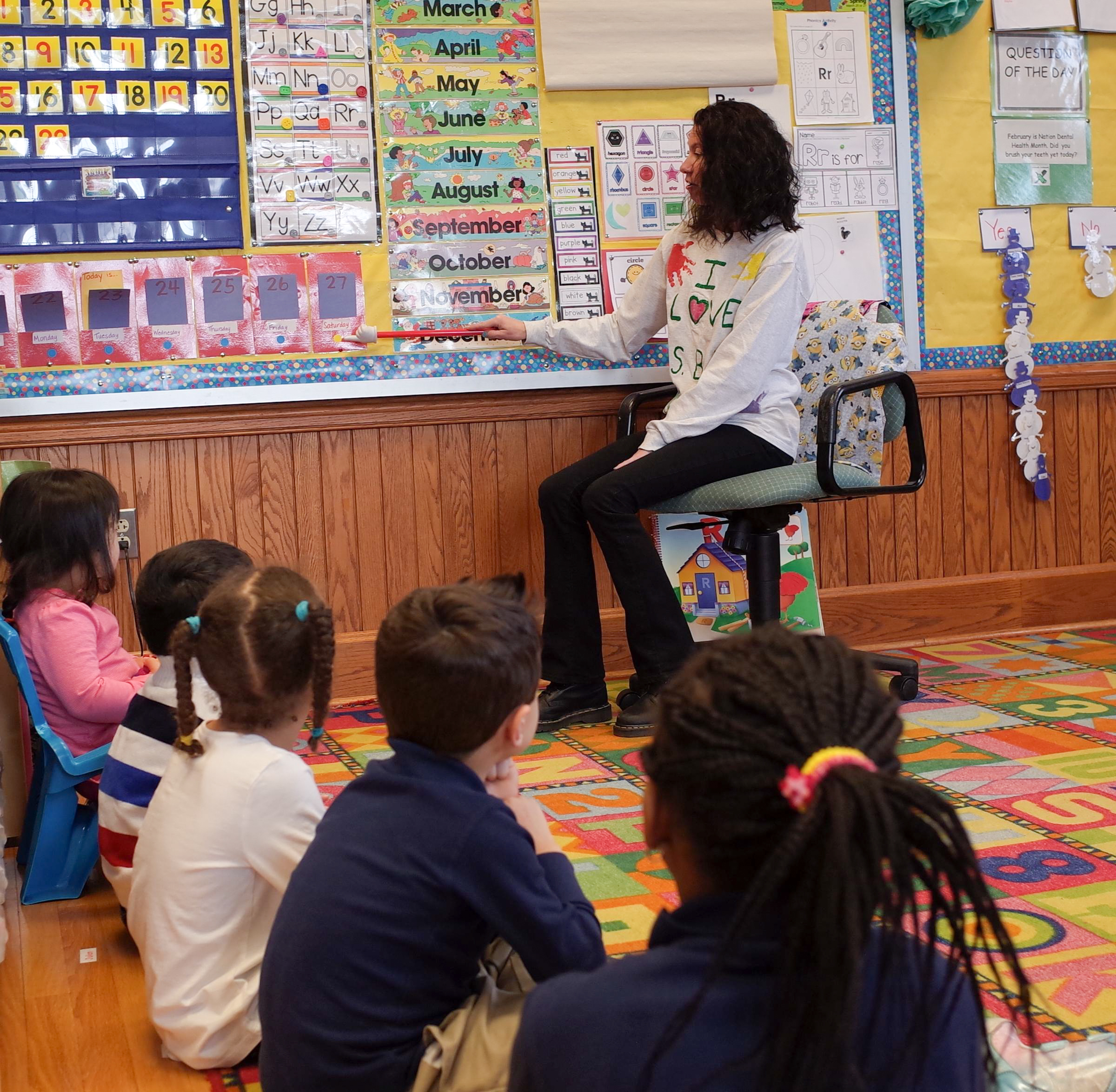 caption: Preschool teacher Cindy Bly opens class at Quinsigamond School in Worcester, Massachusetts.  Many of the pupils in the school come from economically stressed families. Achievement here is ranked in the bottom fifth of the state.