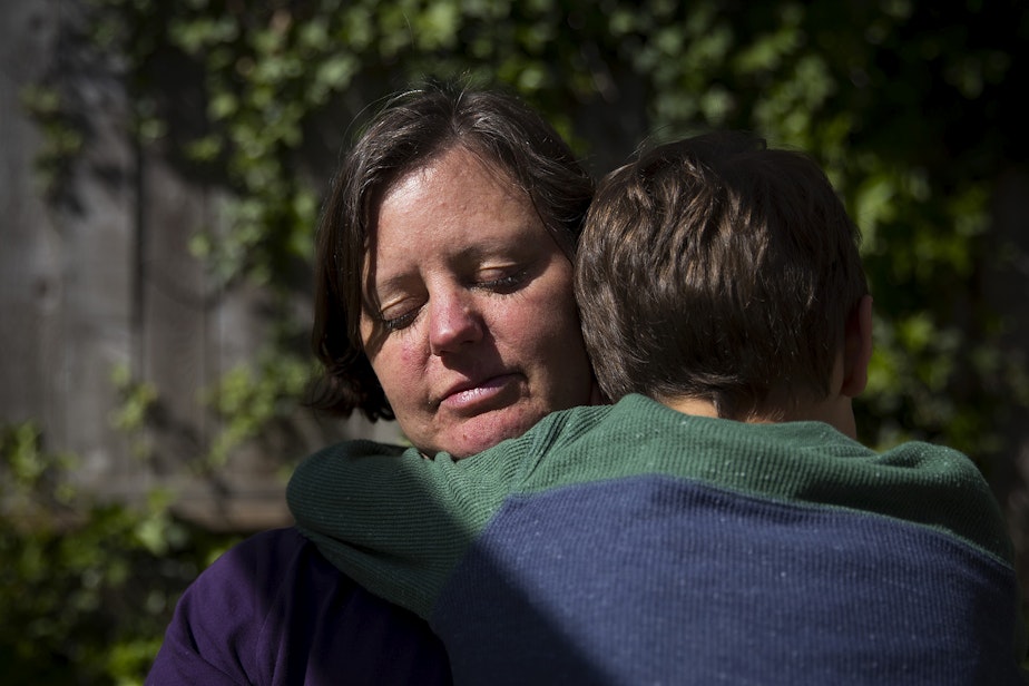caption: Jen Apfel of south Seattle holds her 7-year-old son Max. “I used to feel a lot of shame around it. I have no issue talking about it at all. I just feel good about sharing those experiences if it might help someone. After my son was born I had ongoing horrible anxiety driving him across the bridge, just like being terrified every time, scared of car accidents, all the horrible images in my head."