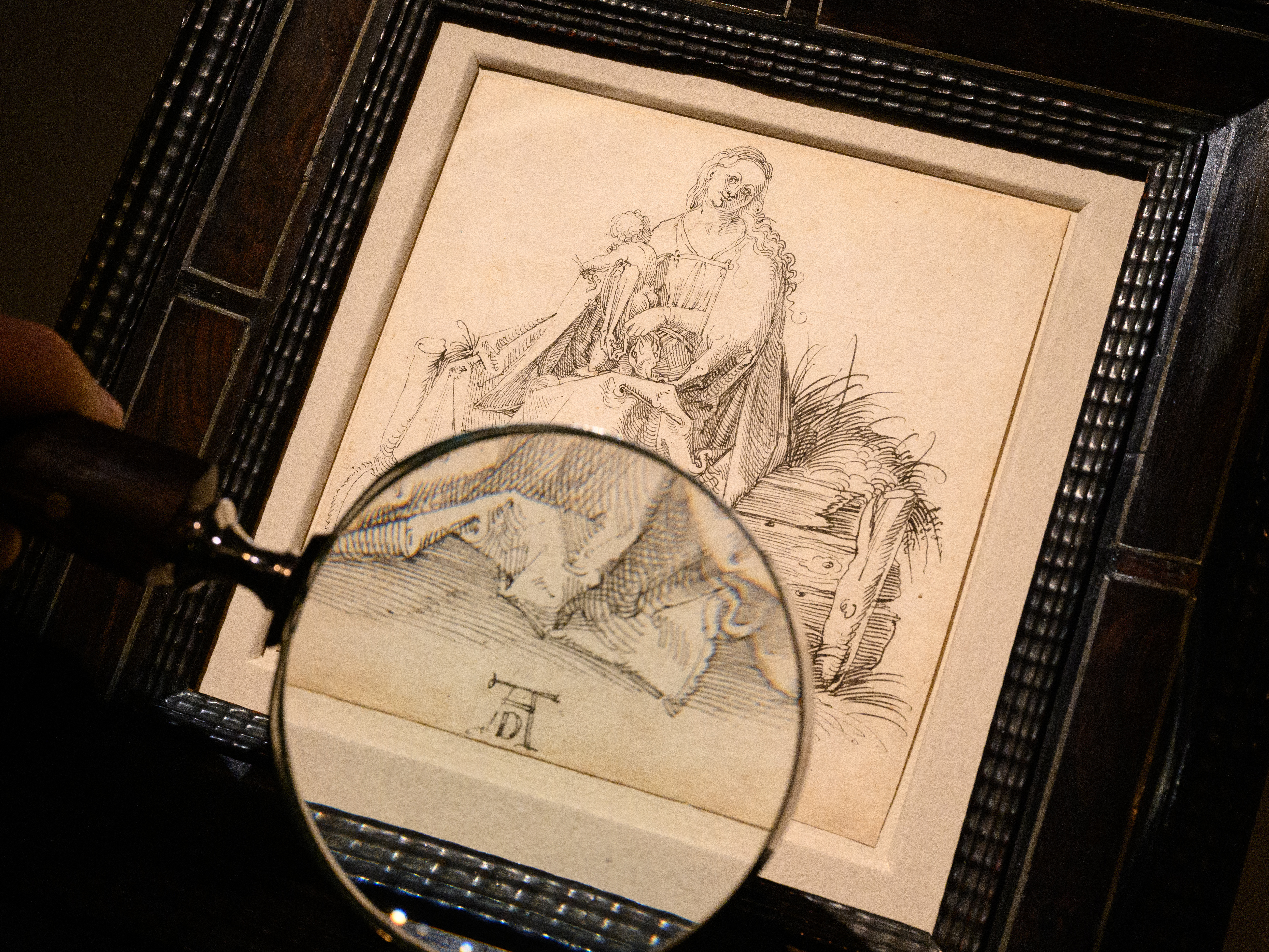 caption: A pen and black ink drawing by Albrecht Dürer titled "The Virgin and Child with a Flower on a grassy Bench" is seen at London Art Week dealer Agnews, on Nov. 19, in London.