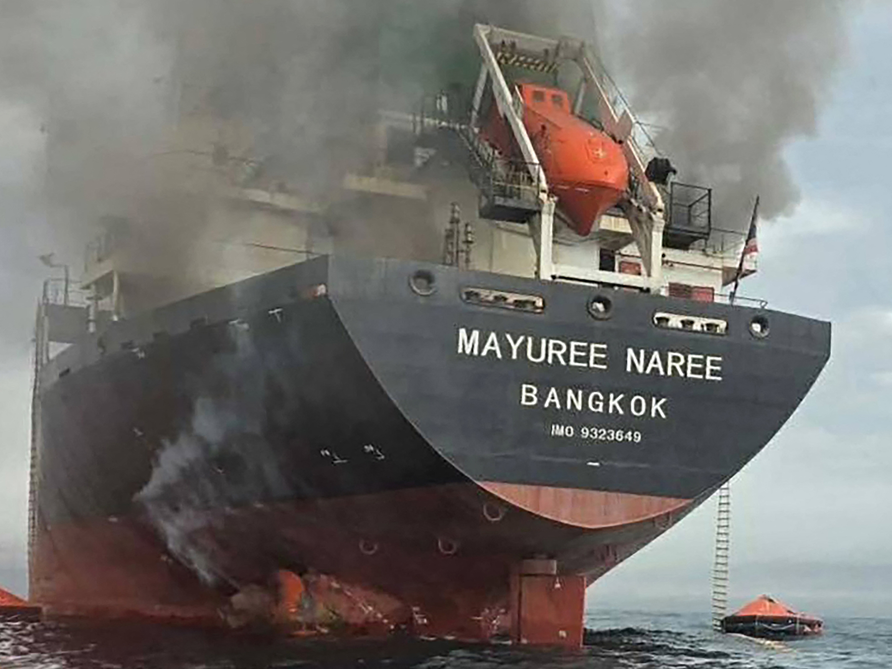 caption: A handout photo taken on March 11, 2026 and released by the Royal Thai Navy shows smoke rising from the Thai bulk carrier 'Mayuree Naree' near the Strait of Hormuz after an attack.