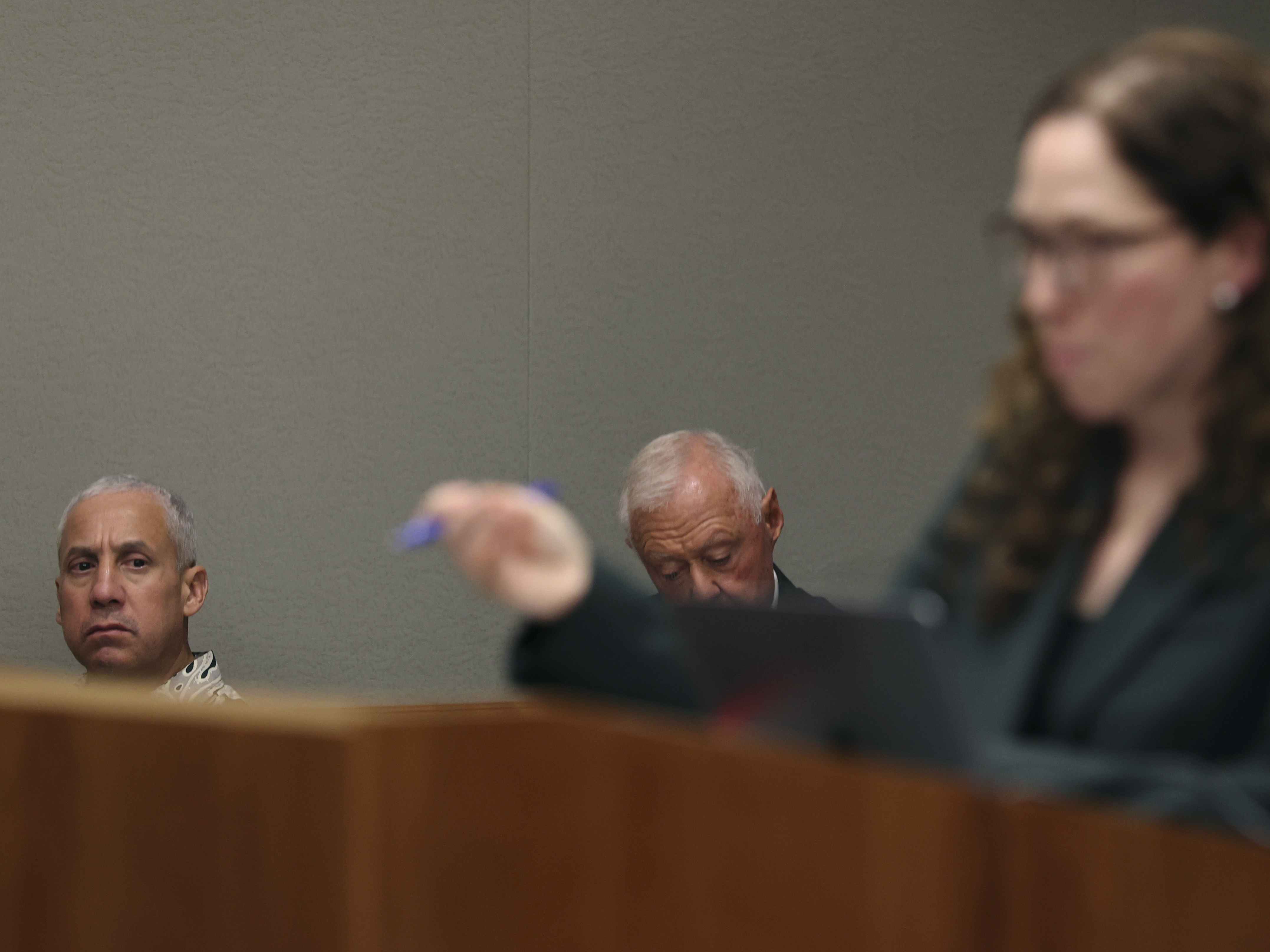 caption: Albert "Ian" Schweitzer, left, looks on as Innocence Project attorney Susan Freidman speaks during Schweitzer's court case Tuesday, Jan. 24, 2023, in Hilo, Hawaii.