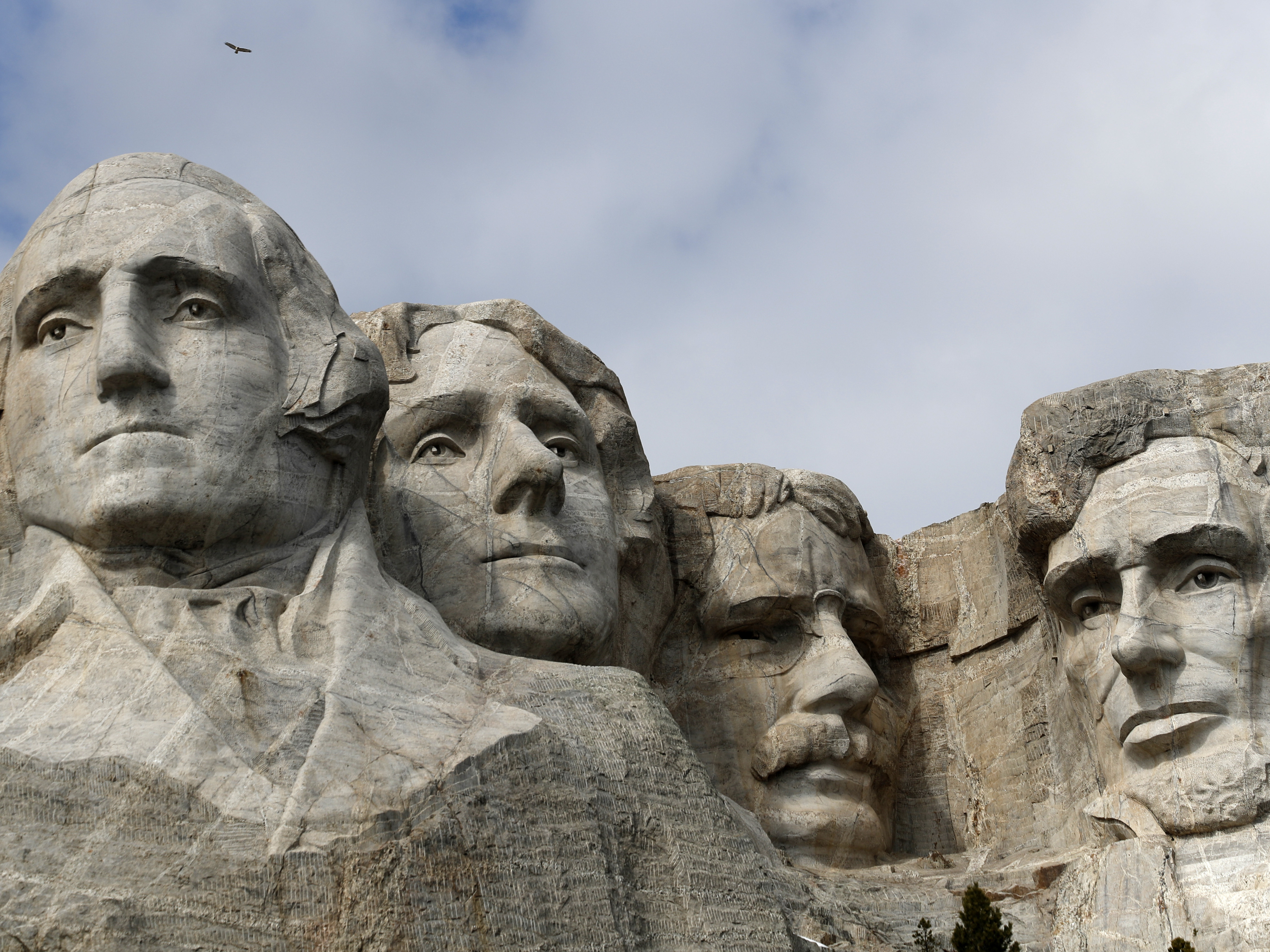 caption: Nearly 400 men and women worked for more than 14 years to carve the images of Presidents Washington, Jefferson, Roosevelt, and Lincoln into Mount Rushmore in Keystone, S.D.