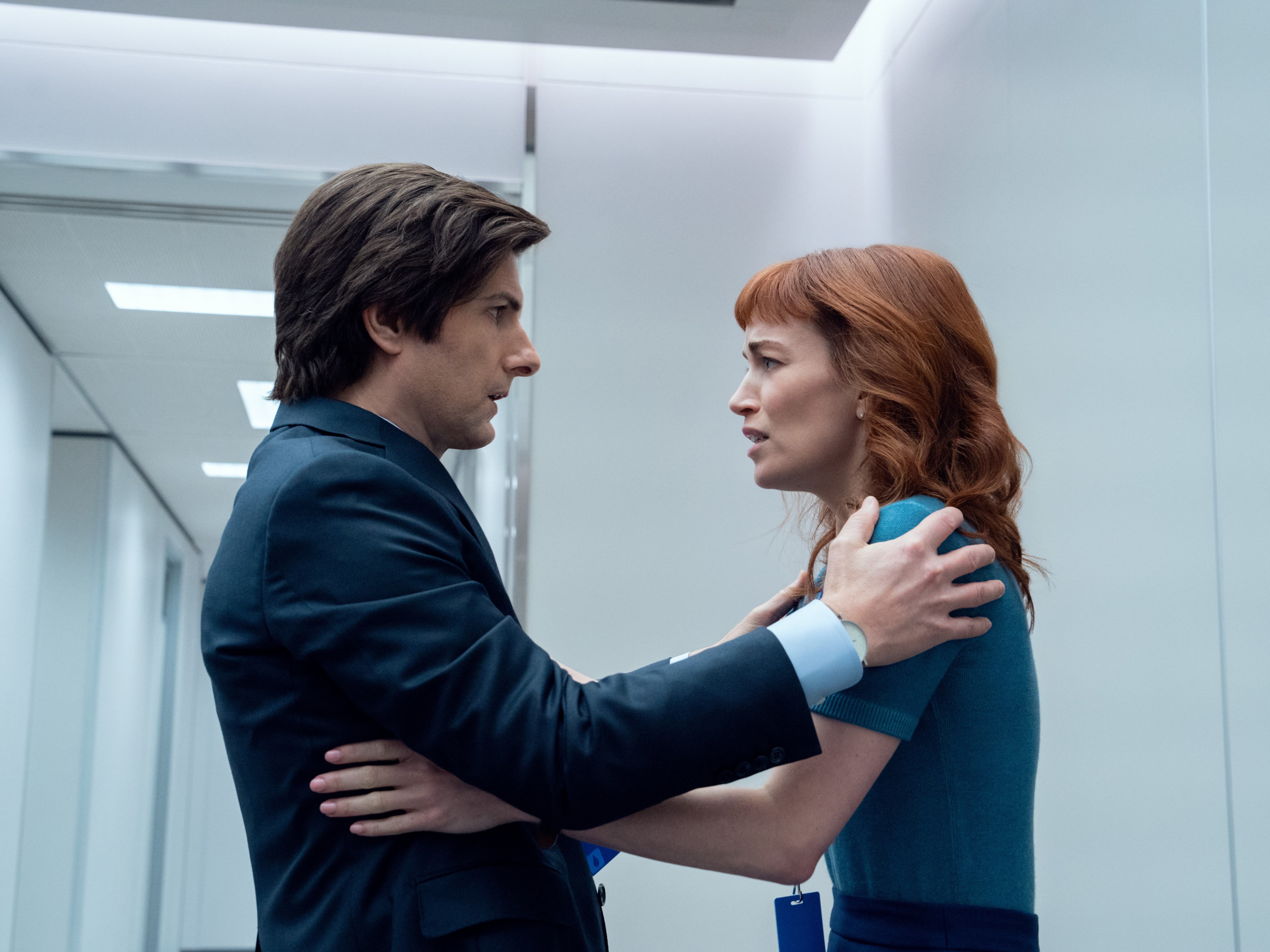 caption: The Apple TV+ series <em>Severance</em> returns for a second season on Friday, Jan. 17. Above, Adam Scott as Mark and Britt Lower as Helly.