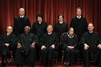 caption: Chief Justice John Roberts called Ginsburg "a jurist of historic stature."