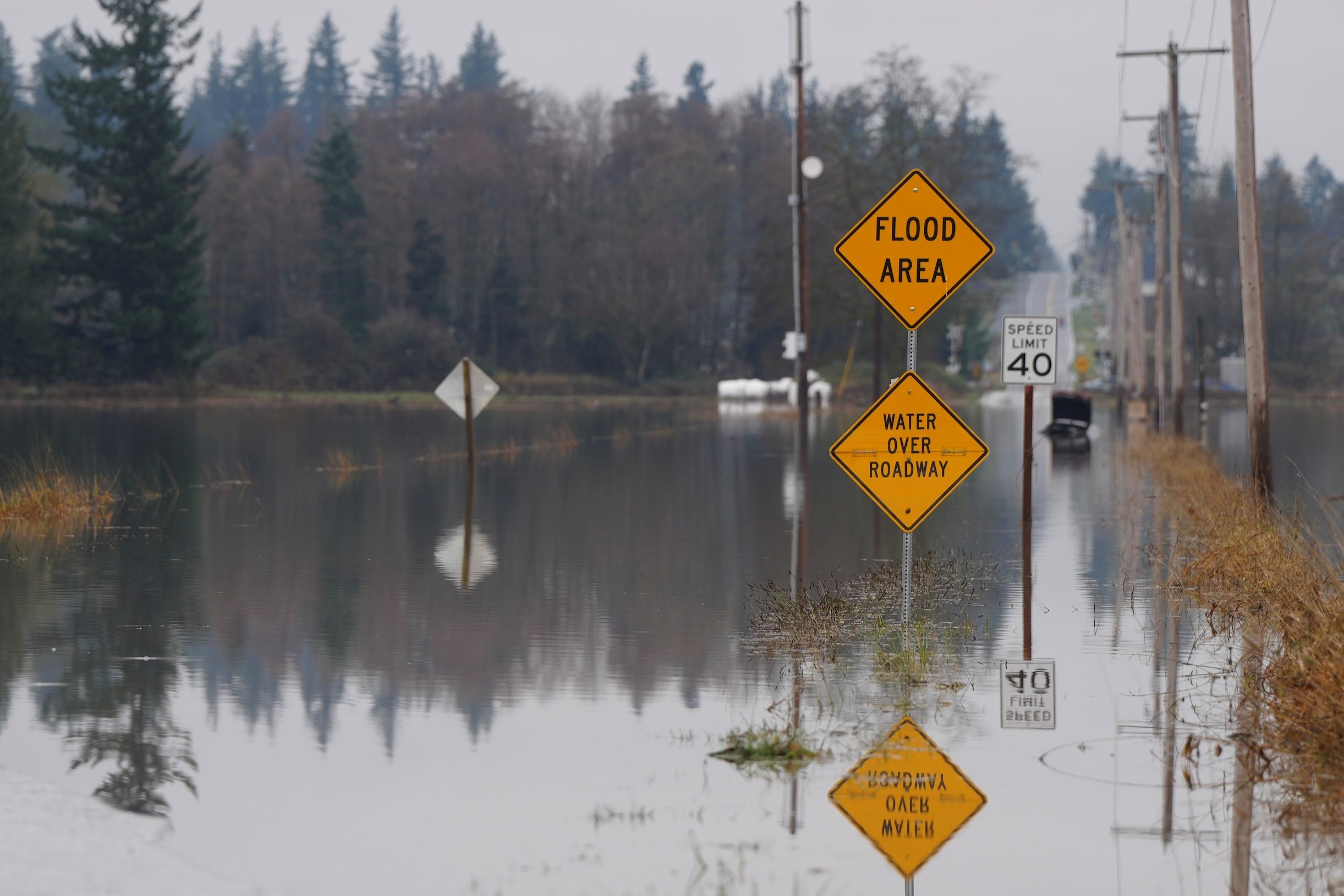 caption: Floodwaters cover Hampton Road near Lynden, Washington, on Dec. 12, 2025.