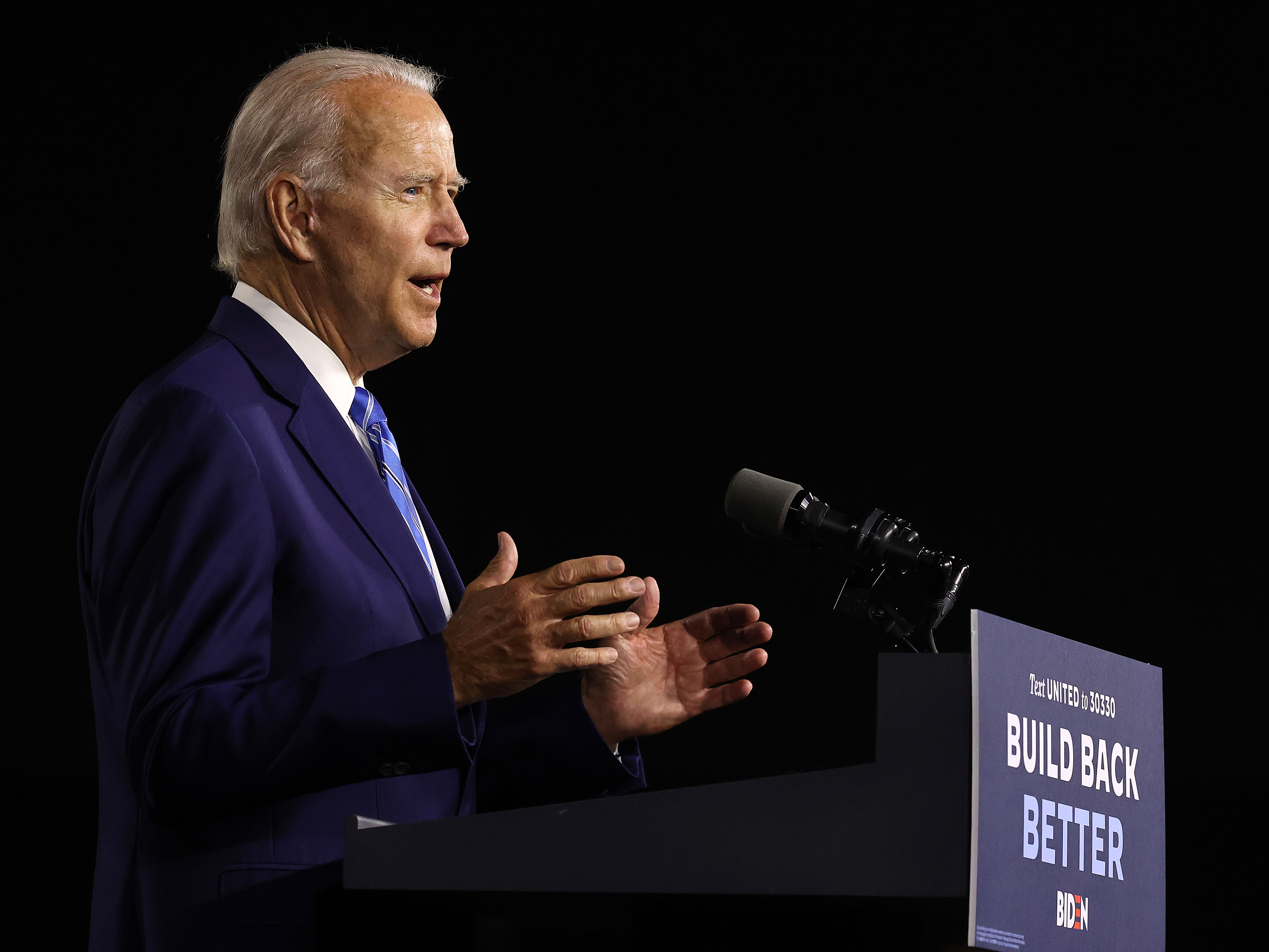 caption: Presumptive Democratic presidential nominee Joe Biden details his $2 trillion climate proposal Tuesday at the Chase Center in Wilmington, Del.