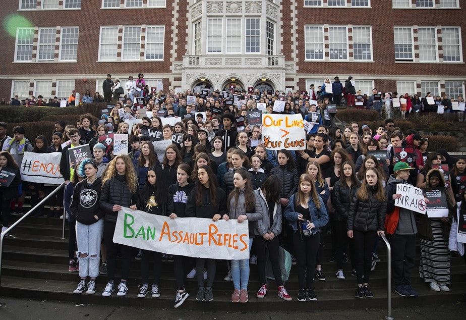 caption: FILE: Students from Garfield High School and Washington Middle School gather on the steps after walking out of class in protest on Wednesday, March 14, 2018, at Garfield High School in Seattle.