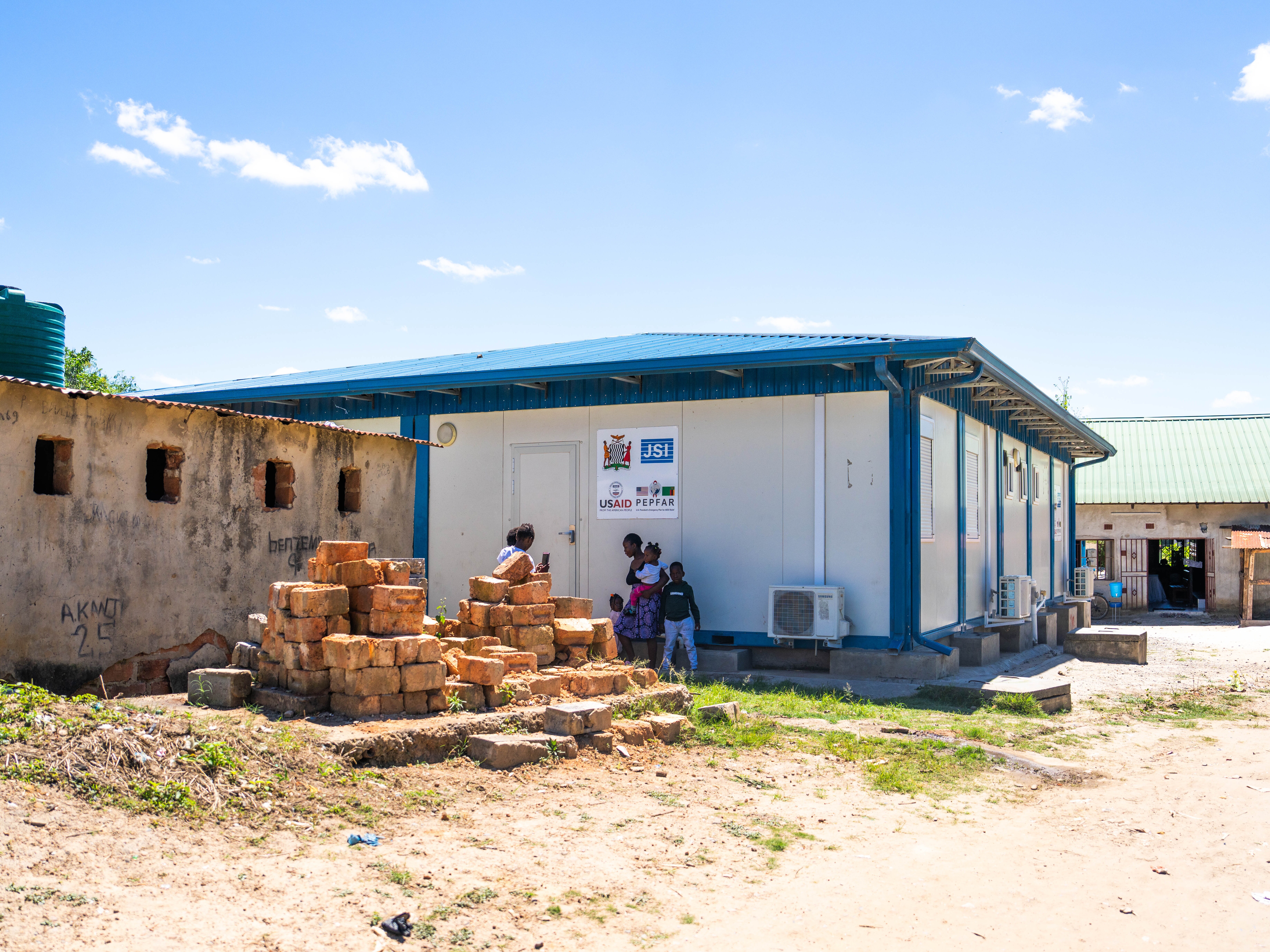 caption: Funded by PEPFAR, this clinic in Kitwe, Zambia, provided medicines for patients who are HIV positive. President Trump's foreign aid overhaul interrupted operations in 2025.