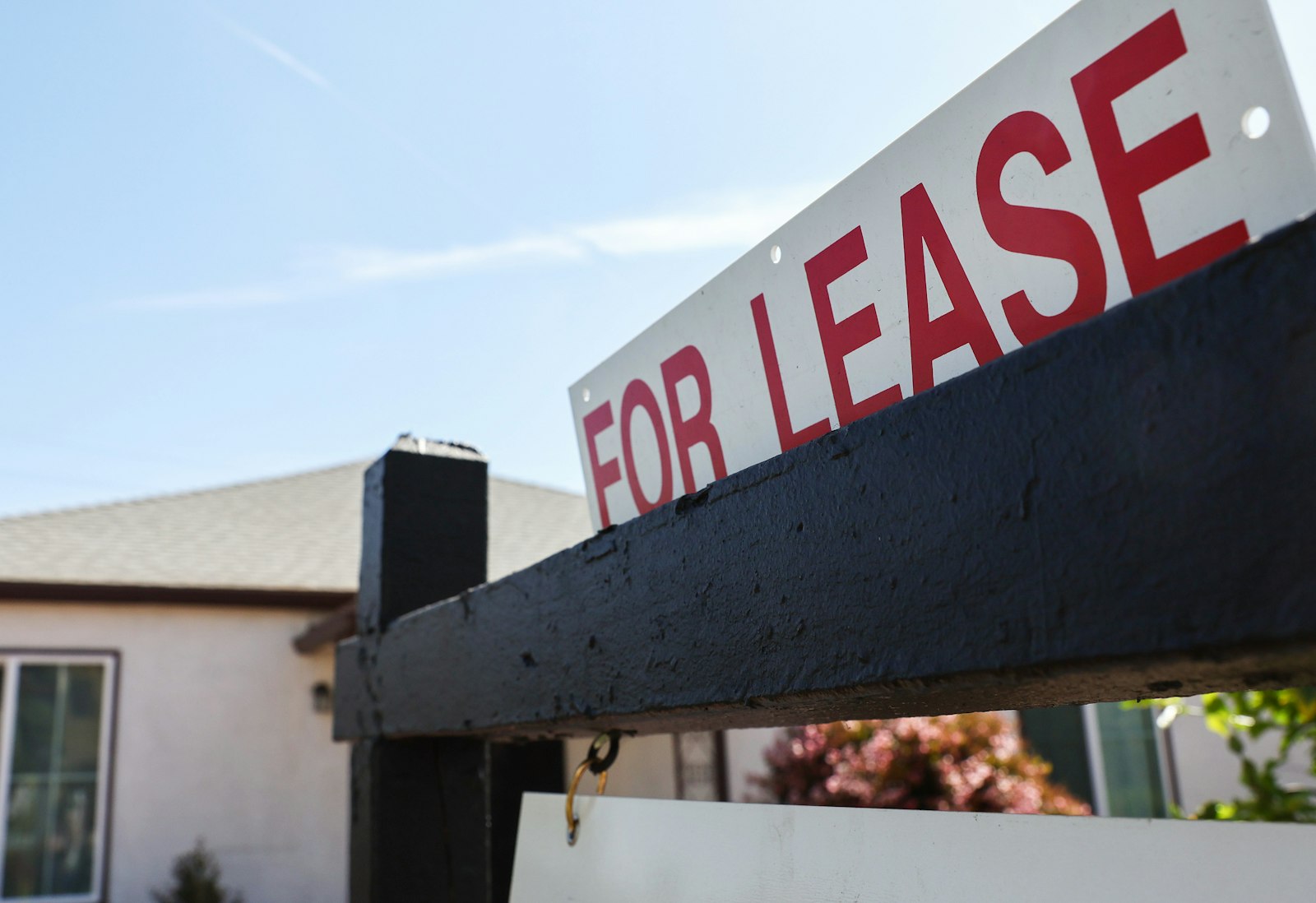 A for lease sign in front of a house